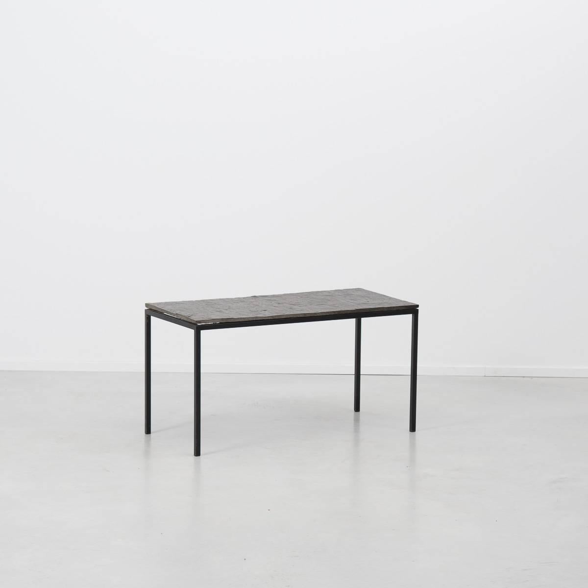 Minimalist slate and steel side table or small coffee table designed by Floris Fiedeldij for Artimeta Soest, Holland in the 1960s. A dark slate top sits atop a black steel frame. The table is in excellent vintage condition.

Artimeta also produced