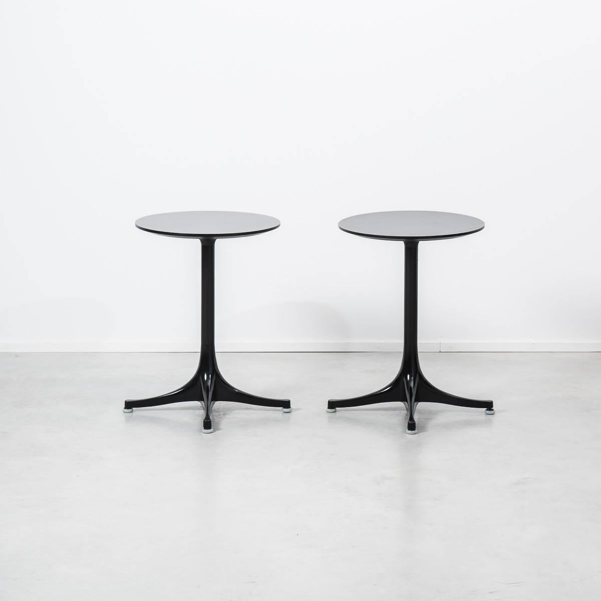 Rare pair of original 5451 tables designed by George Nelson for Herman Miller. Hard to come by edition, featuring stained black birch ply rather than laminated tops, with champfered edges. Tubular steel base and supports and legs in die-cast