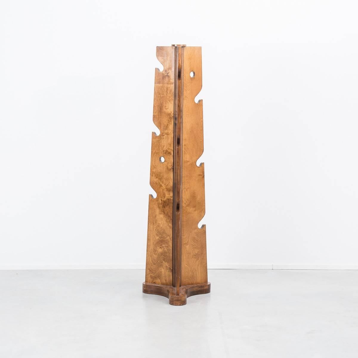 Coat hanger or sculpture? This coat stand originates from Italy, circa 1960s. Its TOTEM like shape has a really playful and surreal aesthetic, contrasting with a traditional French polish finish. Created with three faces it would work well against a