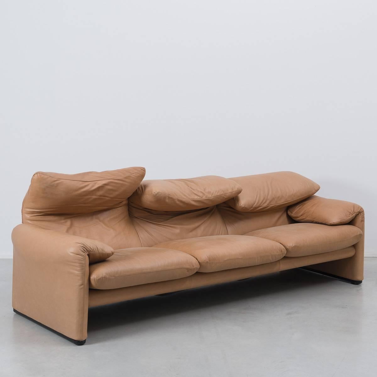 The Maralunga sofa by Magistretti for Cassina was designed in 1973 and quickly became a design Classic. Its clever design incorporates manipulatable back cushions that can sit low, directly behind the user when seated, or extended up to provide the