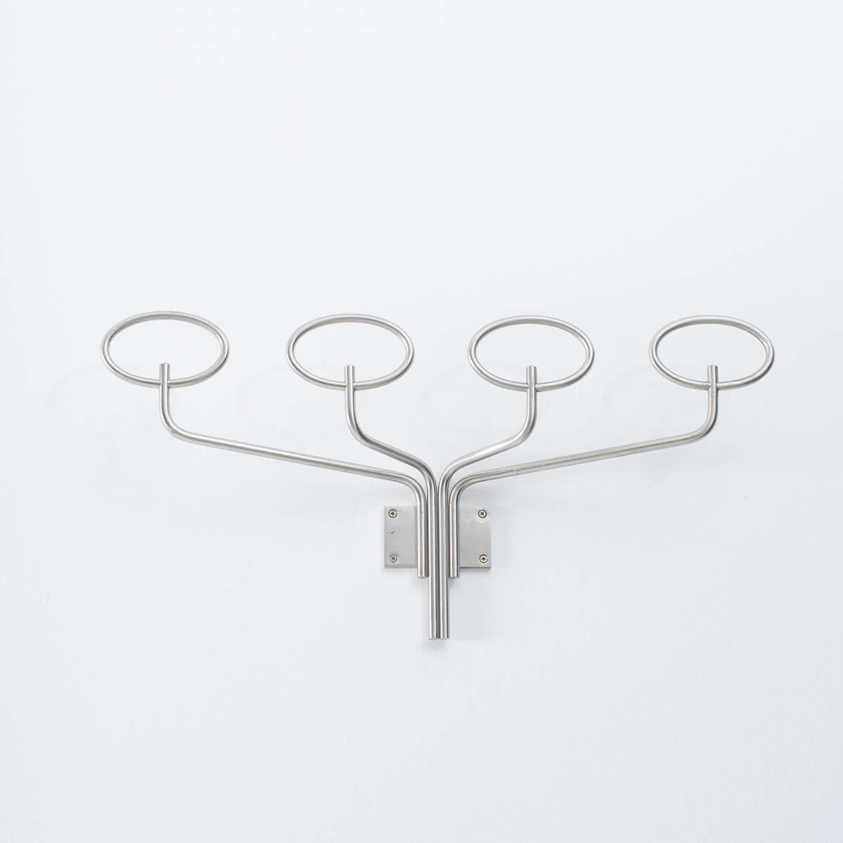 This is a large wall-mounted coat rack by Sergio Mazza for Italian manufacturers Artemide. Made from a process he loved to use, matte finish nickel plated brass. This unusual warm tone has a very slight sheen to it. This elegant coat rack has some