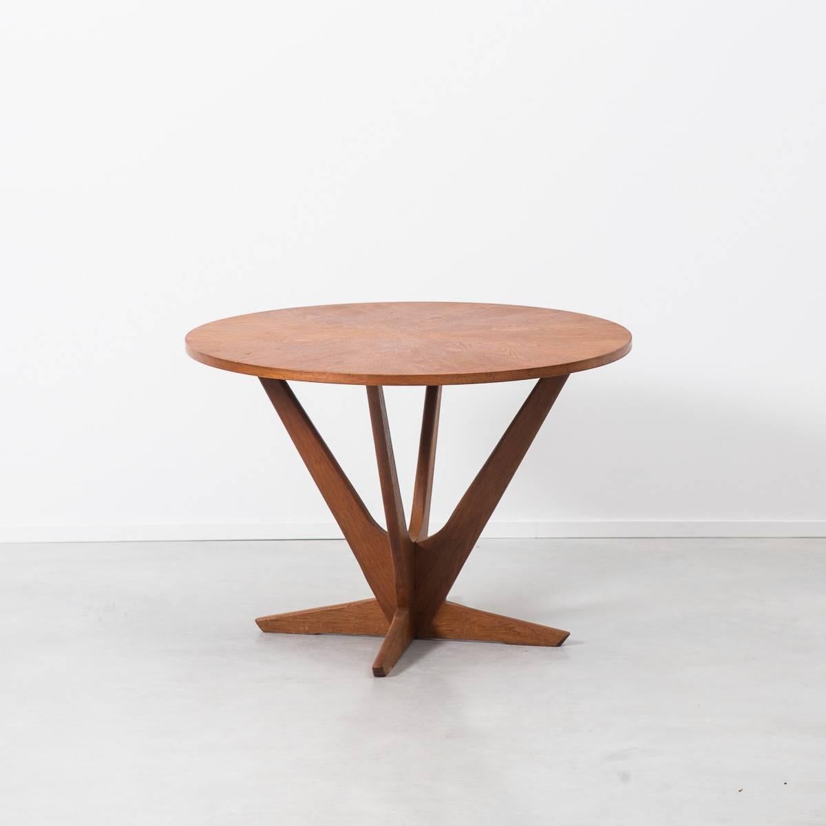 A round teak Danish coffee table designed by Soren Georg Jensen - son of jewellery designer Georg Jensen. Made for Kubus of Denmark in the 1960s, it is organic and naturalistic in form. A graphic teak, radial veneered top sits on a solid base. A