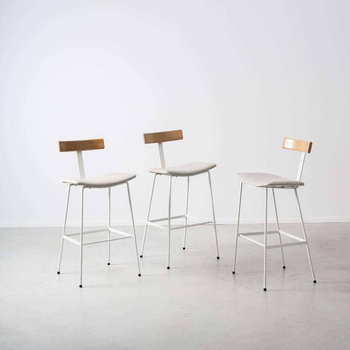 White framed Program stool, designed in 1958 by Frank Guille for Kandya. A stripped-back Minimalist piece, the Program stool is a brilliant example of clean lines and a British utilitarian design. Each stool comprises a steel rod frame and beech