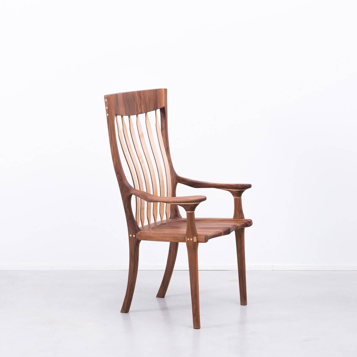 A large hall chair of exceptional quality inspired by the designs of Sam Maloof. Little is known about the maker other than he is a South coast (England) artist who hand made the chair around 20 years ago and sked that his identity not be