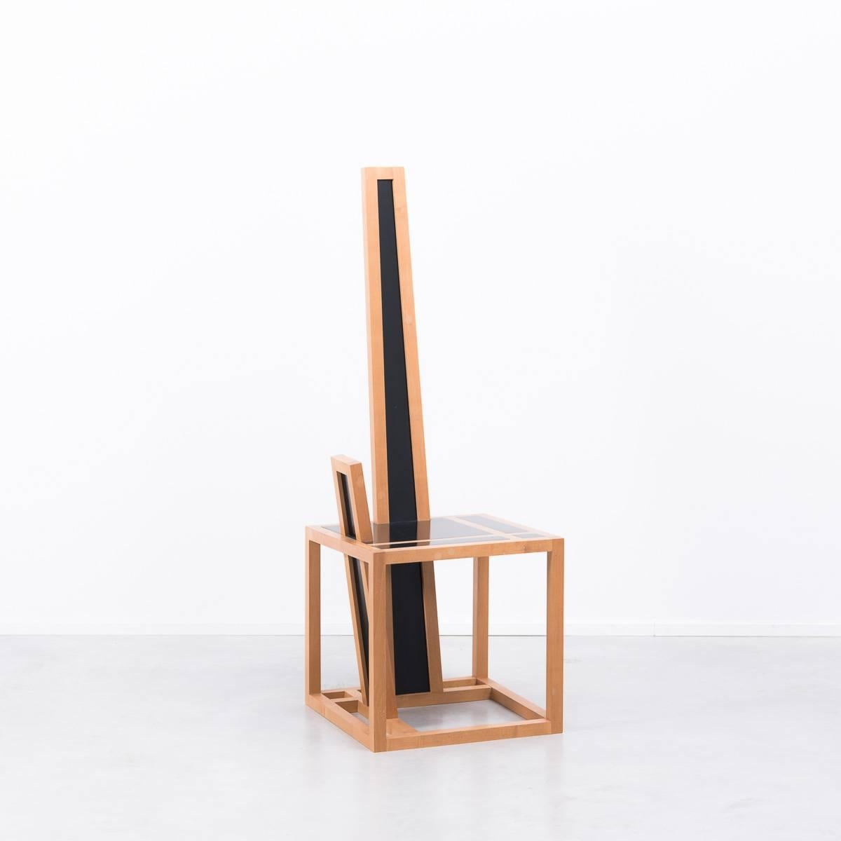 A stunning and sculptural chair handmade from solid maple with black lacquered seating. Little is known about the origins of this design other than it was made in England by an extremely skilled cabinet maker with absolute precision. The apparent