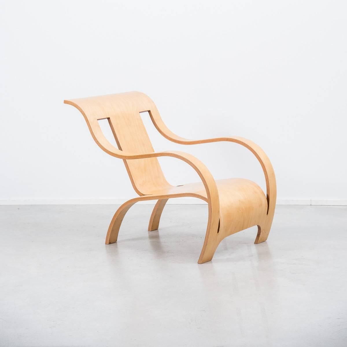 Designed in 1934 by Gerald Summers and originally manufactured by his London company, The Makers of Simple Furniture, the chair is made from a plywood sheet consisting of 13 layers of cross-grained veneer. The sheet is cut with four straight lines,