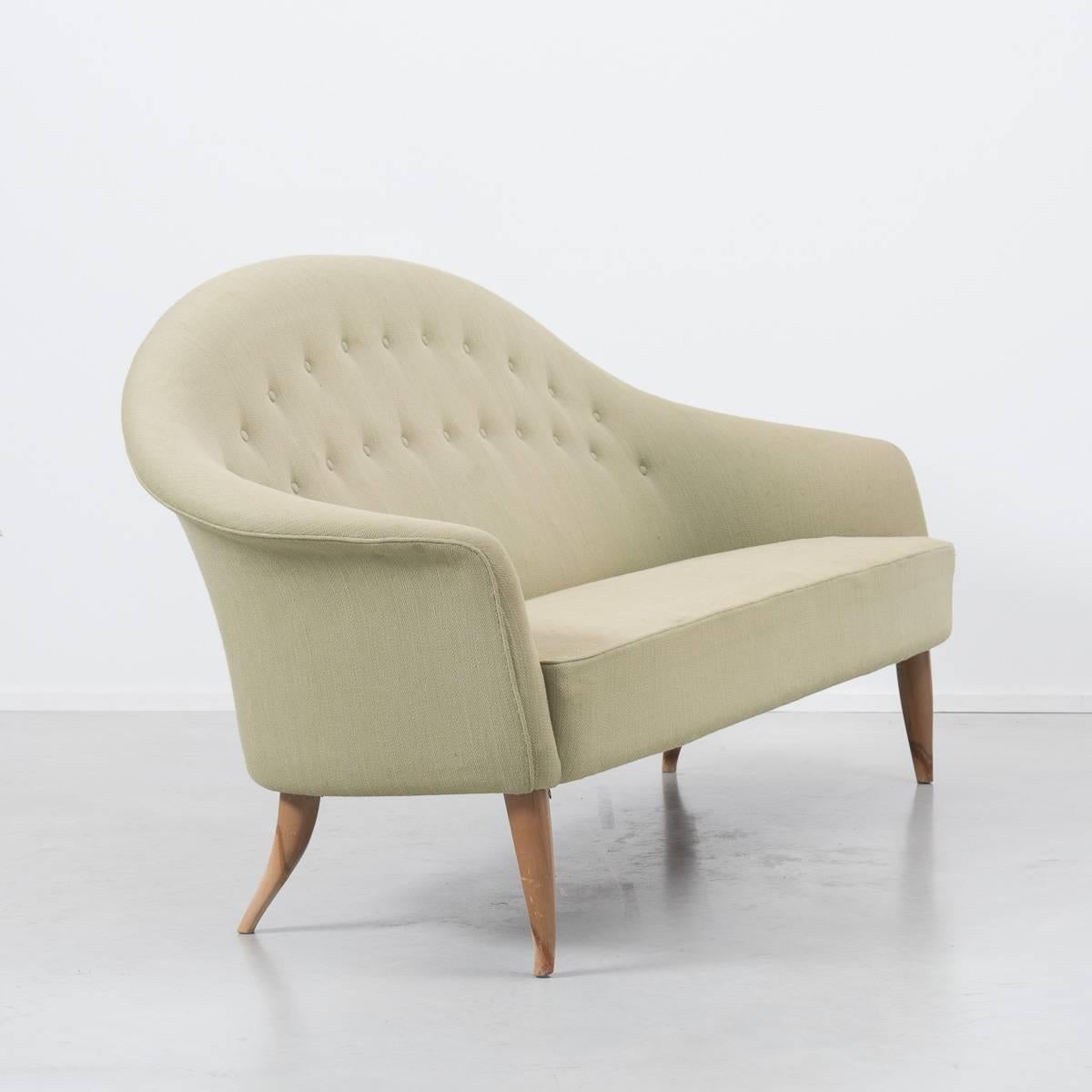 This is the larger three-seat version of the Paradiset sofa. The beautifully tapered legs compliment the curves of the sofa beautifully. The soft lines of the piece give it a soft femininity not usually found in Scandinavian design of the