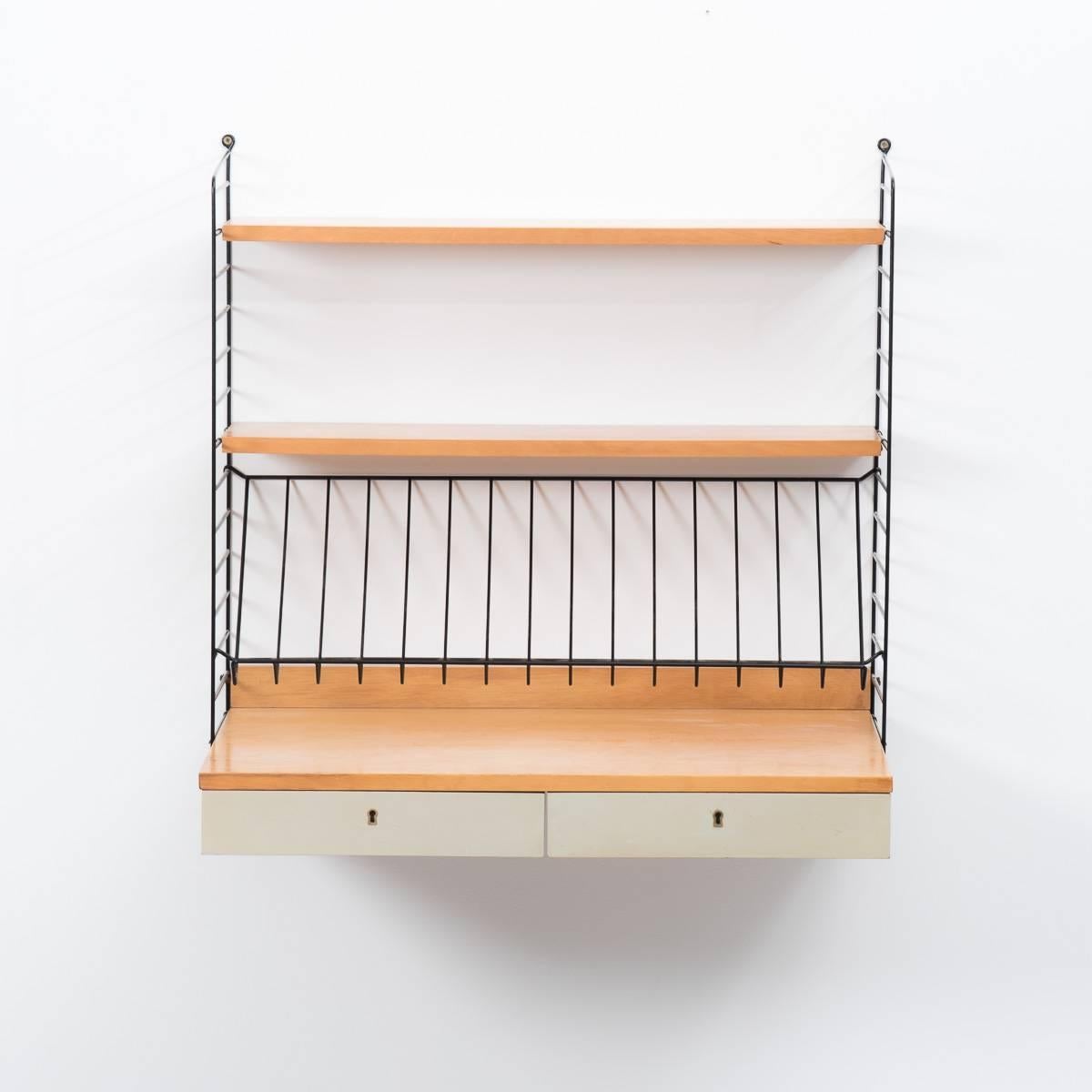 Designed in the early 1950s and still in production today the string system is the most iconic Scandinavian shelving system. This incredibly rare is the only example we have ever seen and has birch ply surfaces which contrast beautifully with the