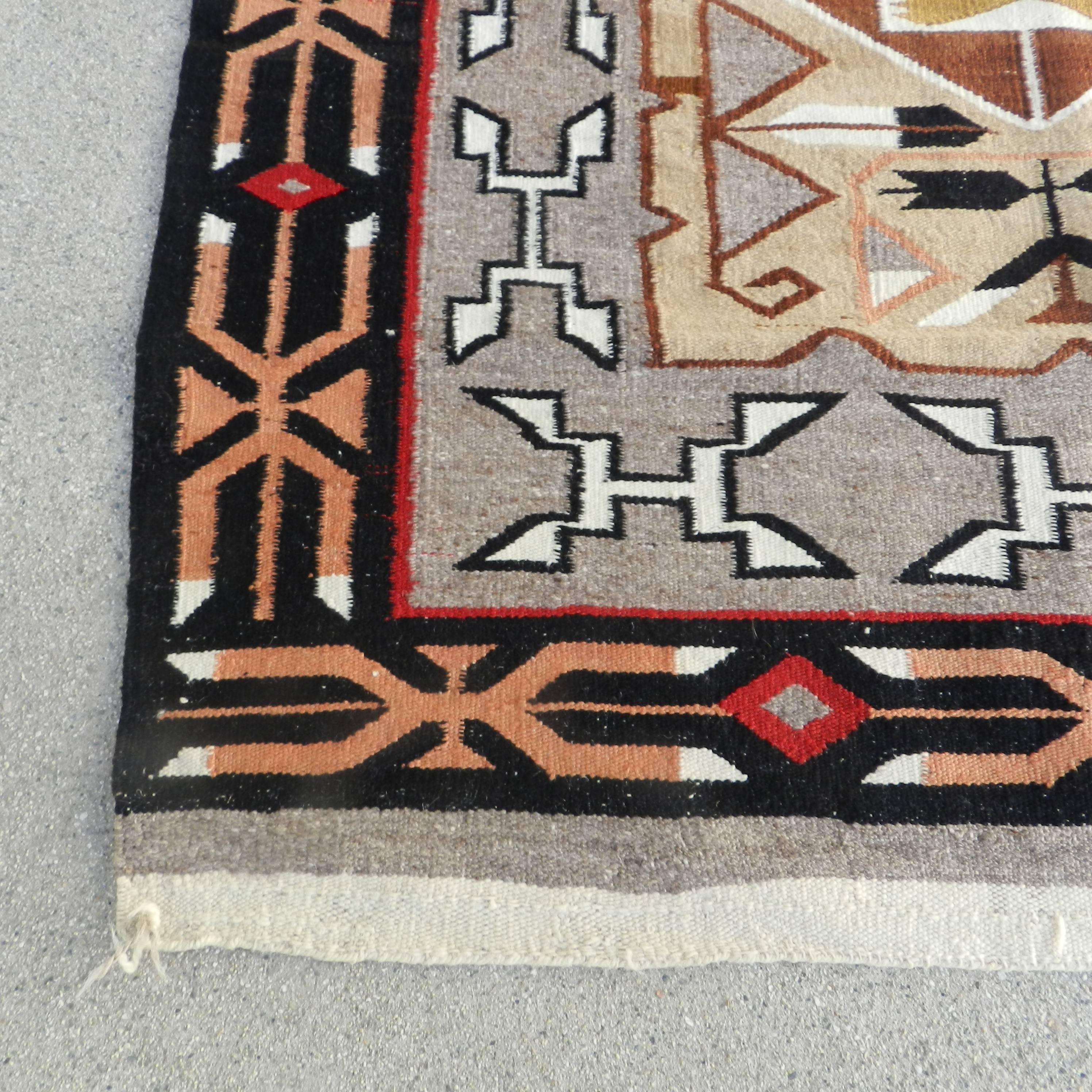 American Very Pretty Old Navajo Trading Post Teec Nos Pos Rug with Feathers For Sale