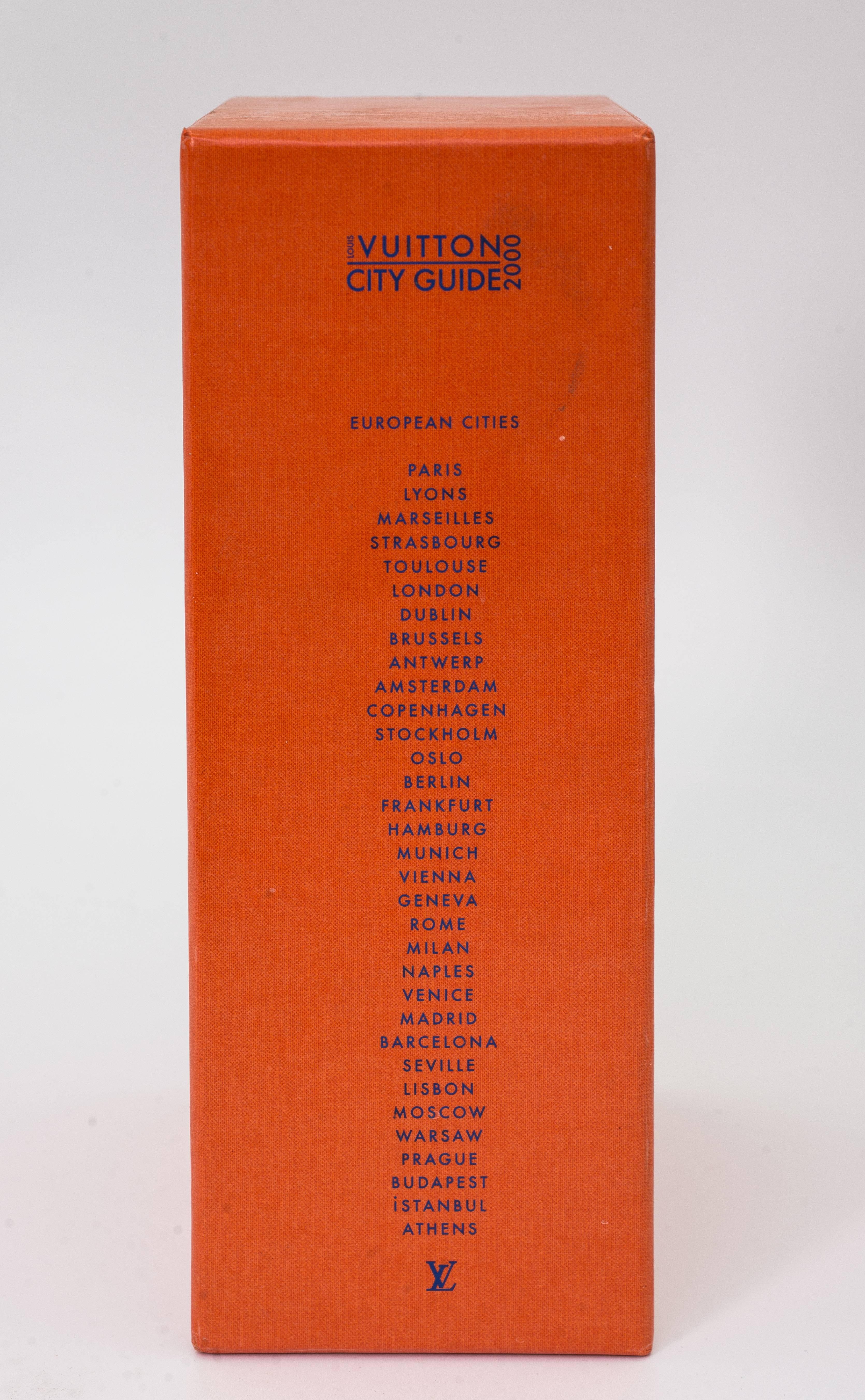 Mint condition unused Louis Vuitton city guide 2000 European cities the first of it's kind. Includes eight European Cities Books covering 33 cities plus the hard cover book holder in orange heavy constructed cardboard. The guide is prepared and