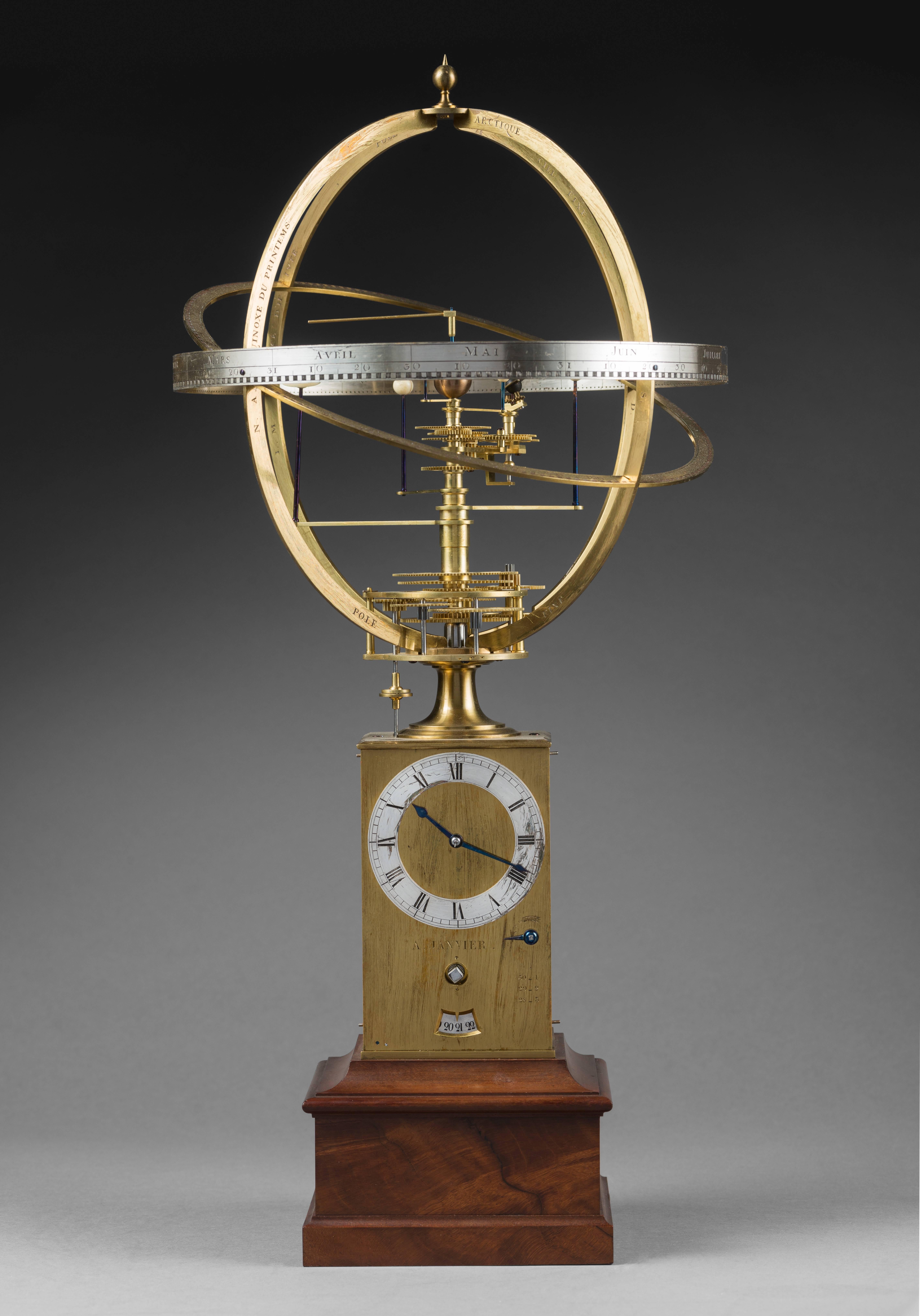 Antide Janvier 
The mahogany base attributed to Ferdinand Schwerdfeger 
exceptional planetarium clock. 
A horological masterpiece.

Paris, begun in 1774 and finished in 1825. 
Measure: Height 51 cm; width 28 cm; depth 28 cm.