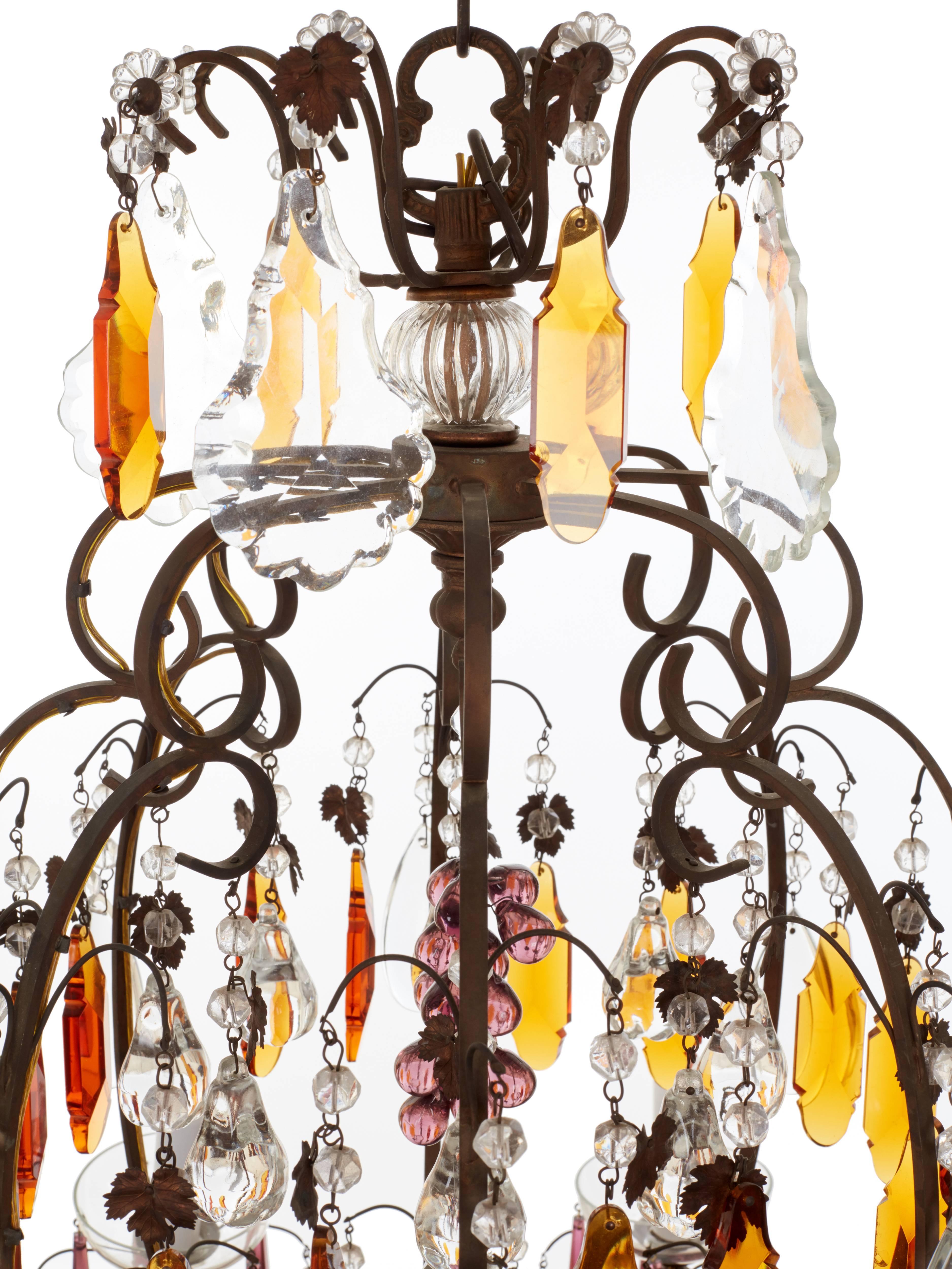 An elegant and unusual balloon shape brass metal frame featuring ten lights. French chandelier with purple icicles and Amber plaques, circa 1900. Fully restored and rewired by Dimitri Stefanov.
