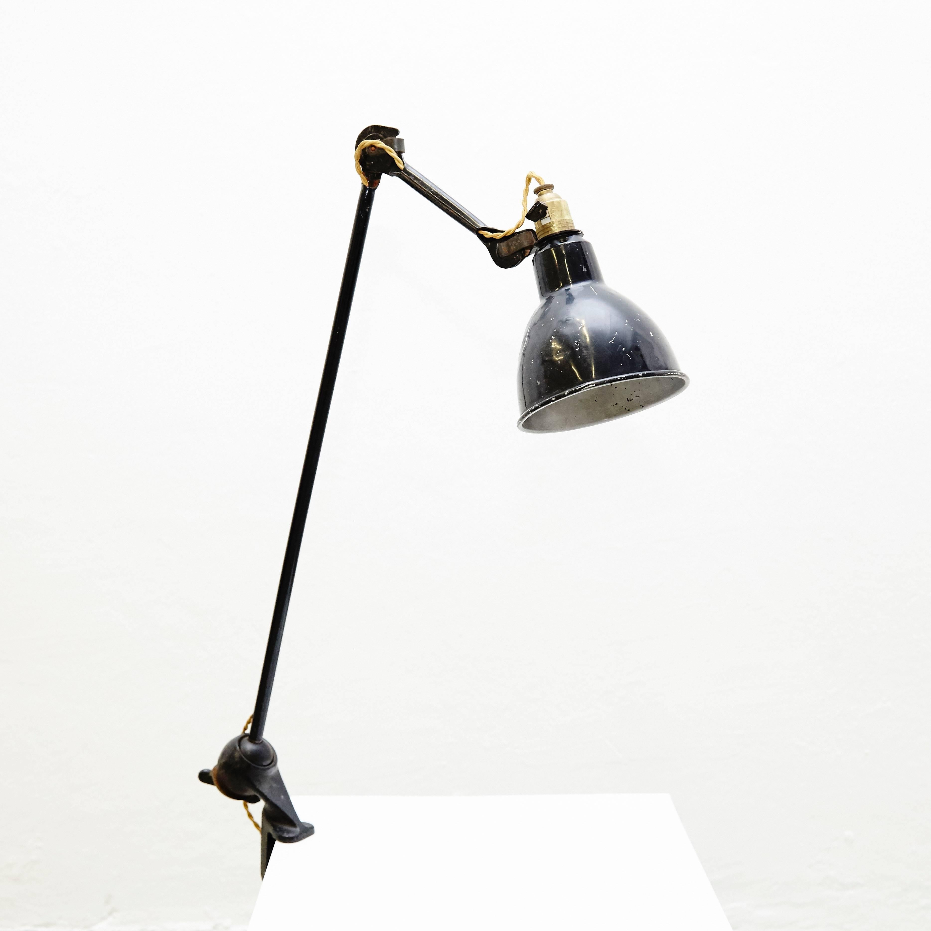 Table Lamp designed by Bernard-Albin Gras.
Manuactured by Gras (France) around 1930.
Aluminium and steel.

In good original condition, with minor wear consistent with age and use, preserving a beautiful patina.

In 1922 Bernard-Albin Gras