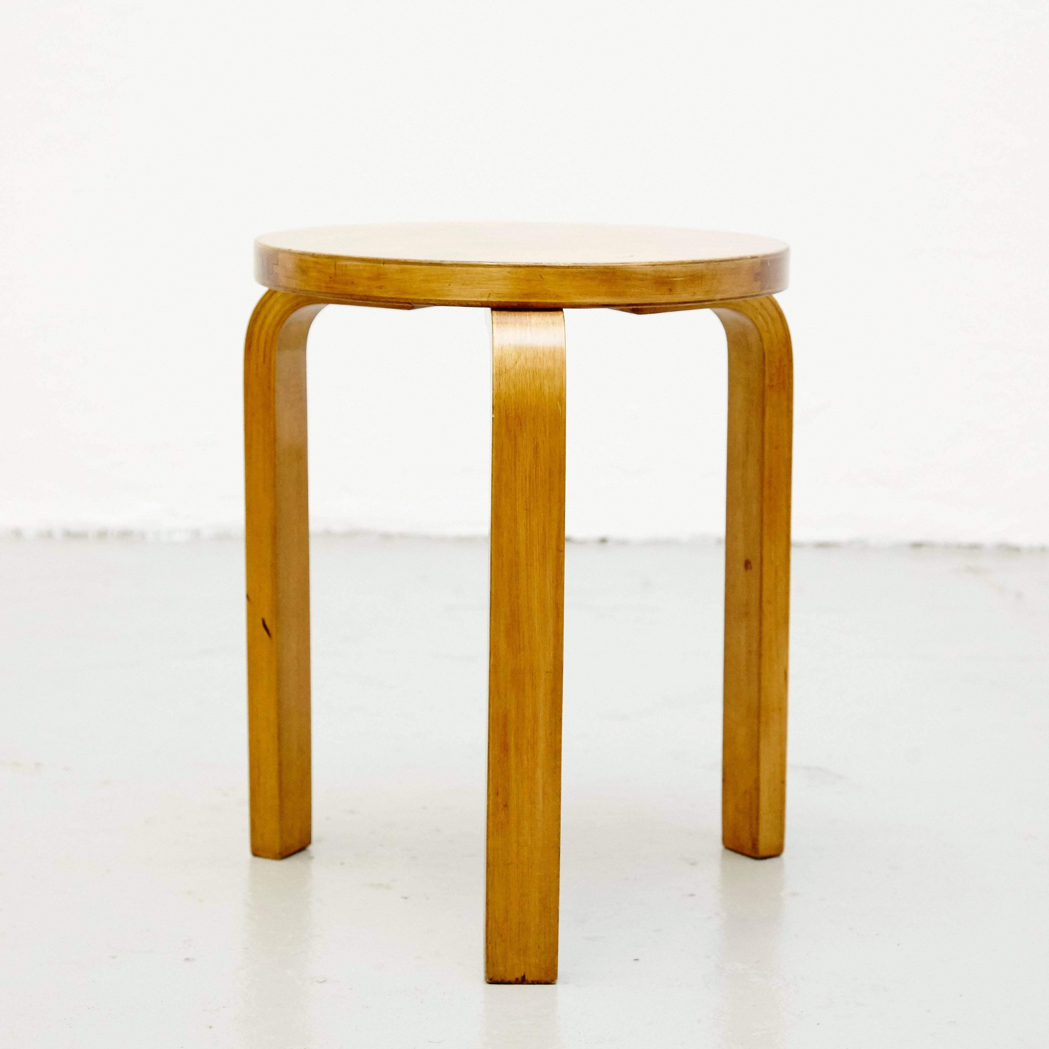 Stool designed by Alvar Aalto, circa 1930.
Manufactured by Artek (Finland) Distributed by Finmar (England).
Wood legs and structure.
Labelled to the underside.

This wood stool is designed by the designer Alvar Aalto. It is a round shaped stool with