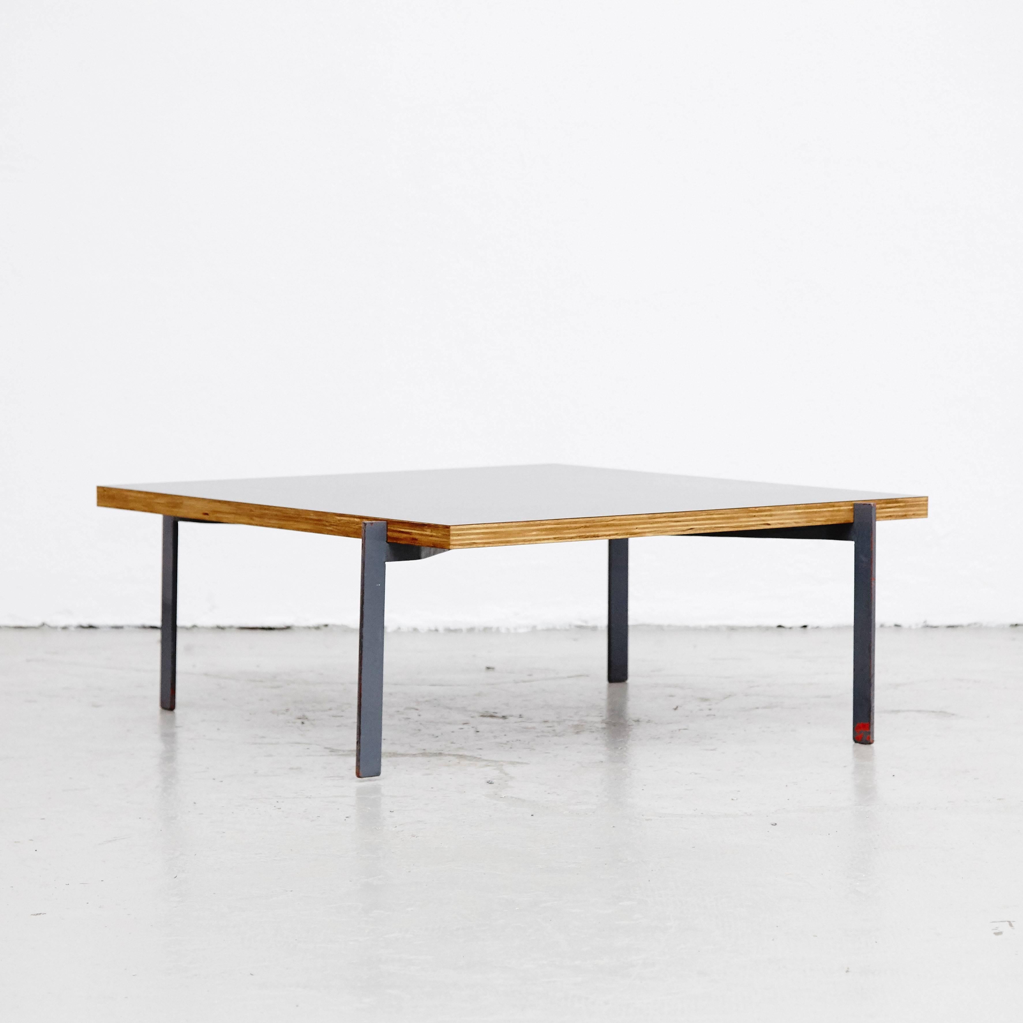 Coffee table in the style of Poul Kjærholm designed in manufactured in Denmark.

Steel and lamieted wood top.

In good original condition, with minor wear consistent with age and use, preserving a beautiful patina.

Poul Kjærholm (January 8,