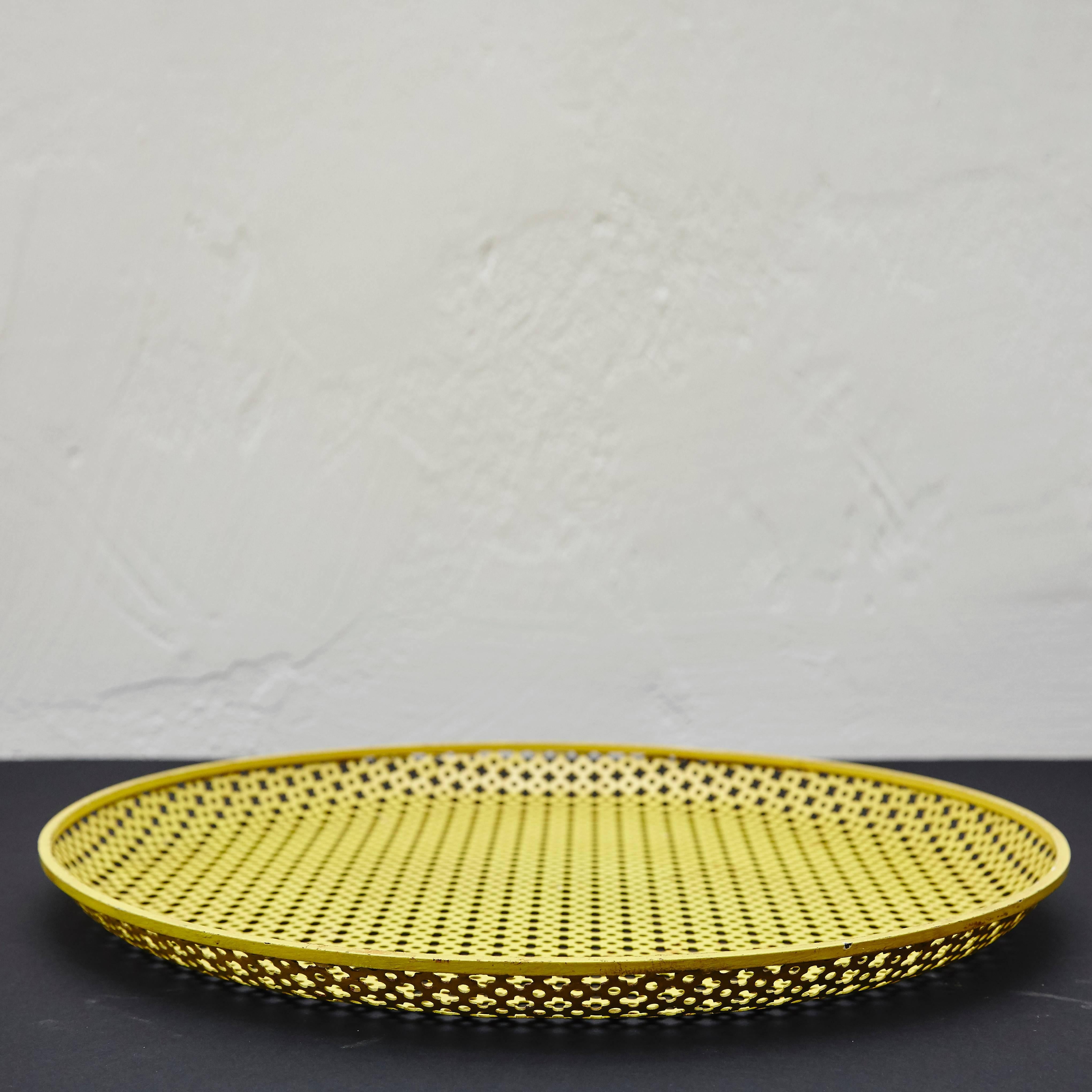 Enameled metal Plate designed by Mathieu Matégot.
Manufactured by Ateliers Matégot (France), circa 1950.
Lacquered perforated metal with original paint.

In original condition, with minor wear consistent with age and use, preserving a beautiful