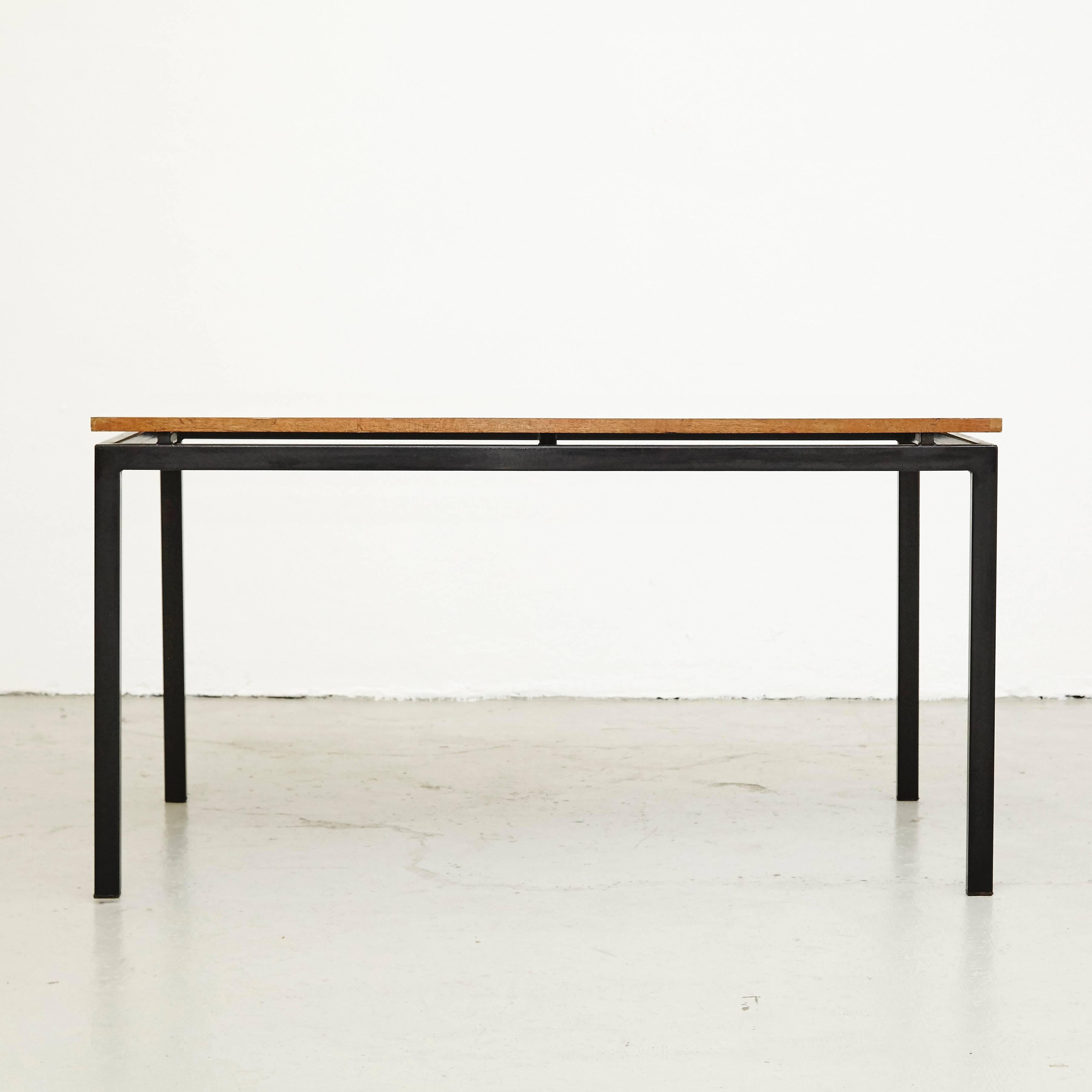 Table designed by Charlotte Perriand, circa 1950.

Wood, metal frame legs.

Provenance: Cansado, Mauritania (Africa).

In good original condition, with minor wear consistent with age and use, preserving a beautiful patina. 

Charlotte