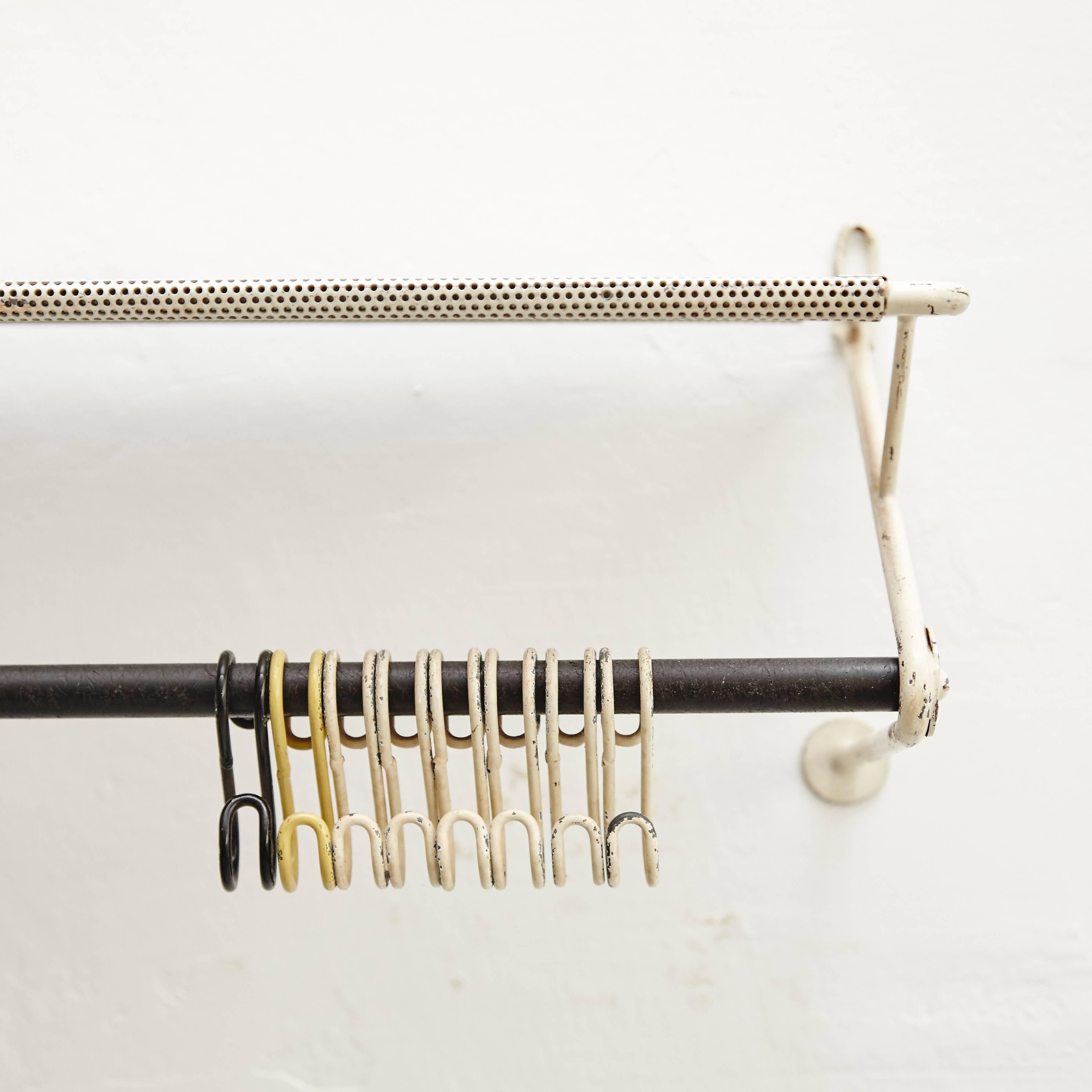 Coat rack designed by Mathieu Matégot.
Manufactured by Artimeta (Netherland), circa 1950.
Perforated, lacquered metal.

In good original condition, with minor wear consistent with age and use, preserving a beautiful patina.

Mathieu Matégot