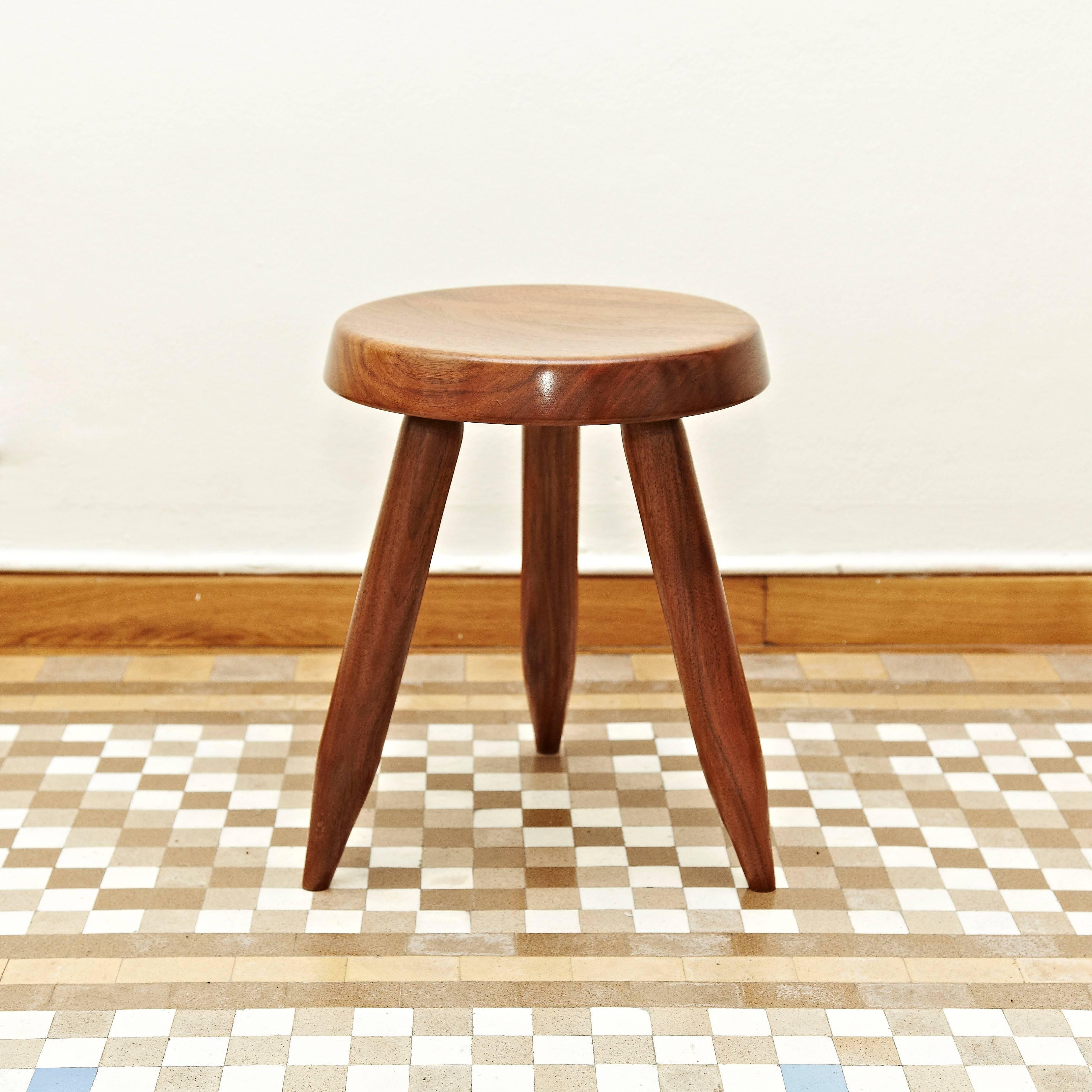 Stool designed in the style of Charlotte Perriand, made by unknown manufacturer.

In good original condition, preserving a beautiful patina, with minor wear consistent with age and use.

Charlotte Perriand (1903-1999) She was born in Paris in
