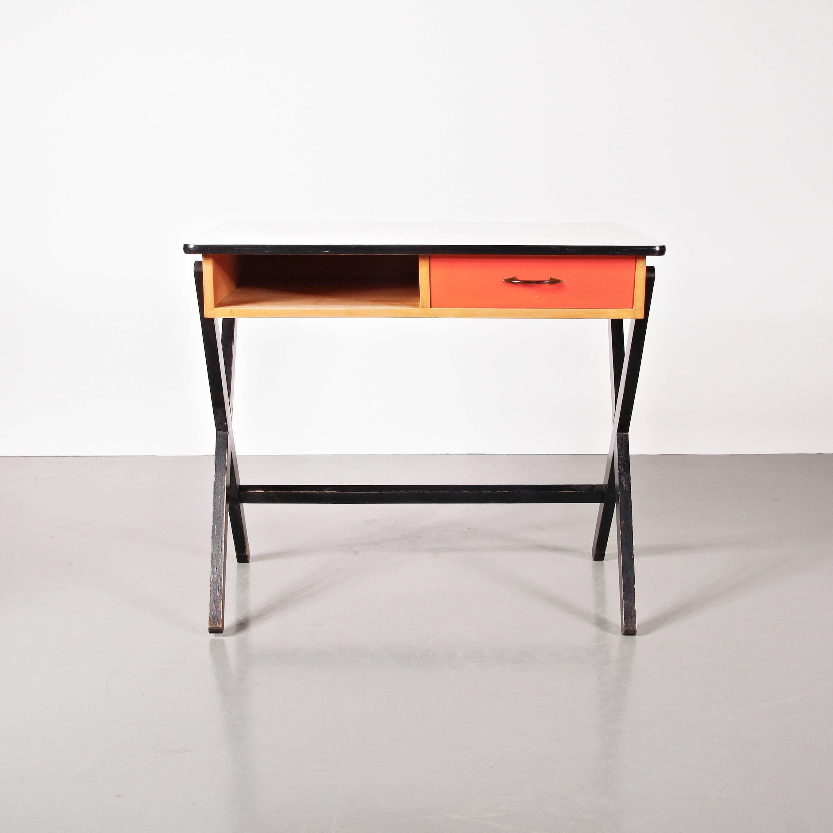 Desk designed by Coen de Vries, circa 1950. Manufactured by Devo (Netherlands) 

Lacquered wood frame, formica tabletop. 

In good original condition, with minor wear consistent with age and use, preserving a nice patina.