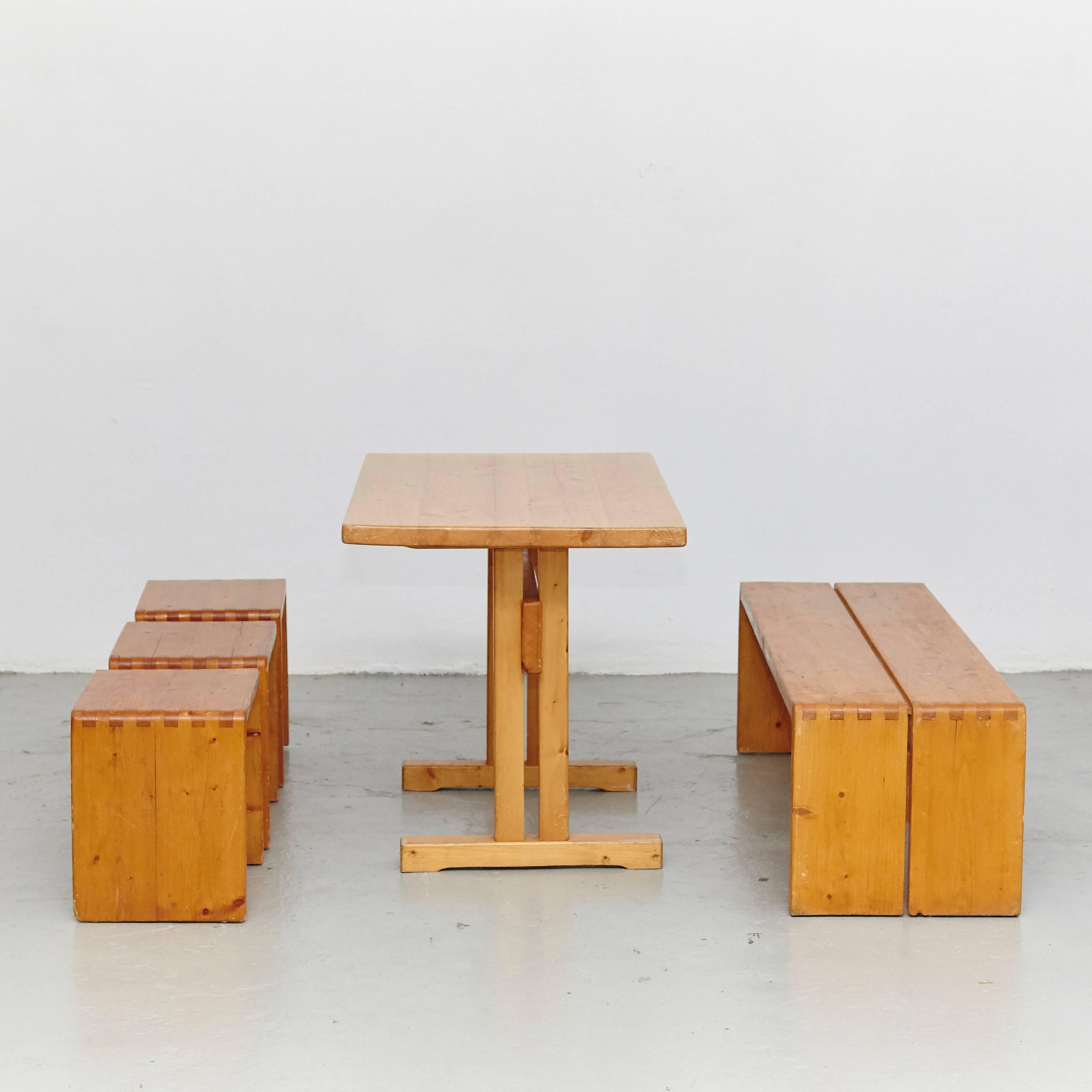 Set of table stools and benches designed by Charlotte Perriand for Les Arcs ski resort, circa 1960, manufactured in France.

Pinewood.

In good original condition, with minor wear consistent with age and use, preserving a beautiful patina.

The