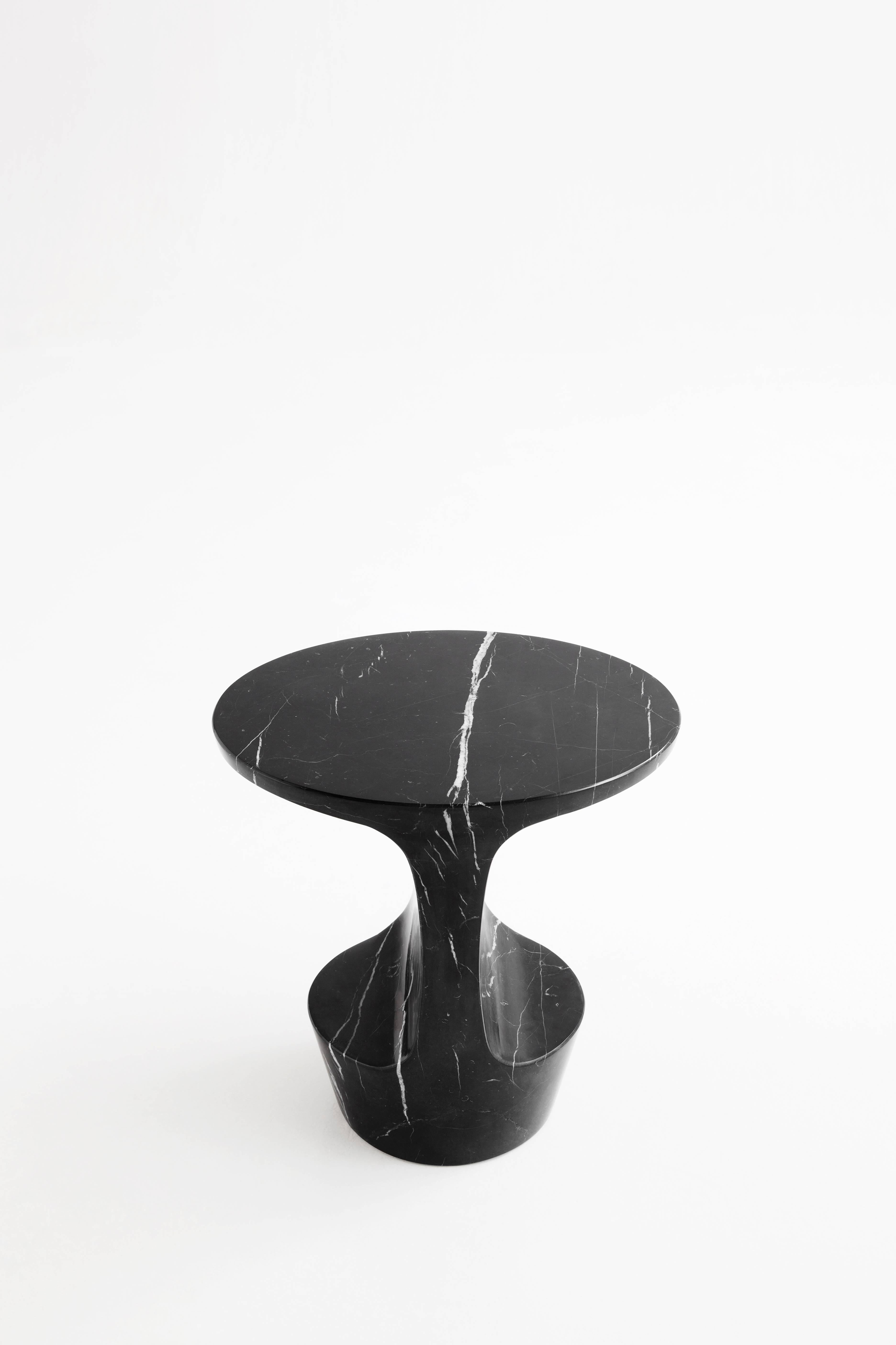 Atlas is a side table made out of a Marquina marble block, extracted in the North of Spain. The piece takes its name after the young titan of the Greek mythology that was fated to sustain the pillars that separated the Earth from Heaven and its