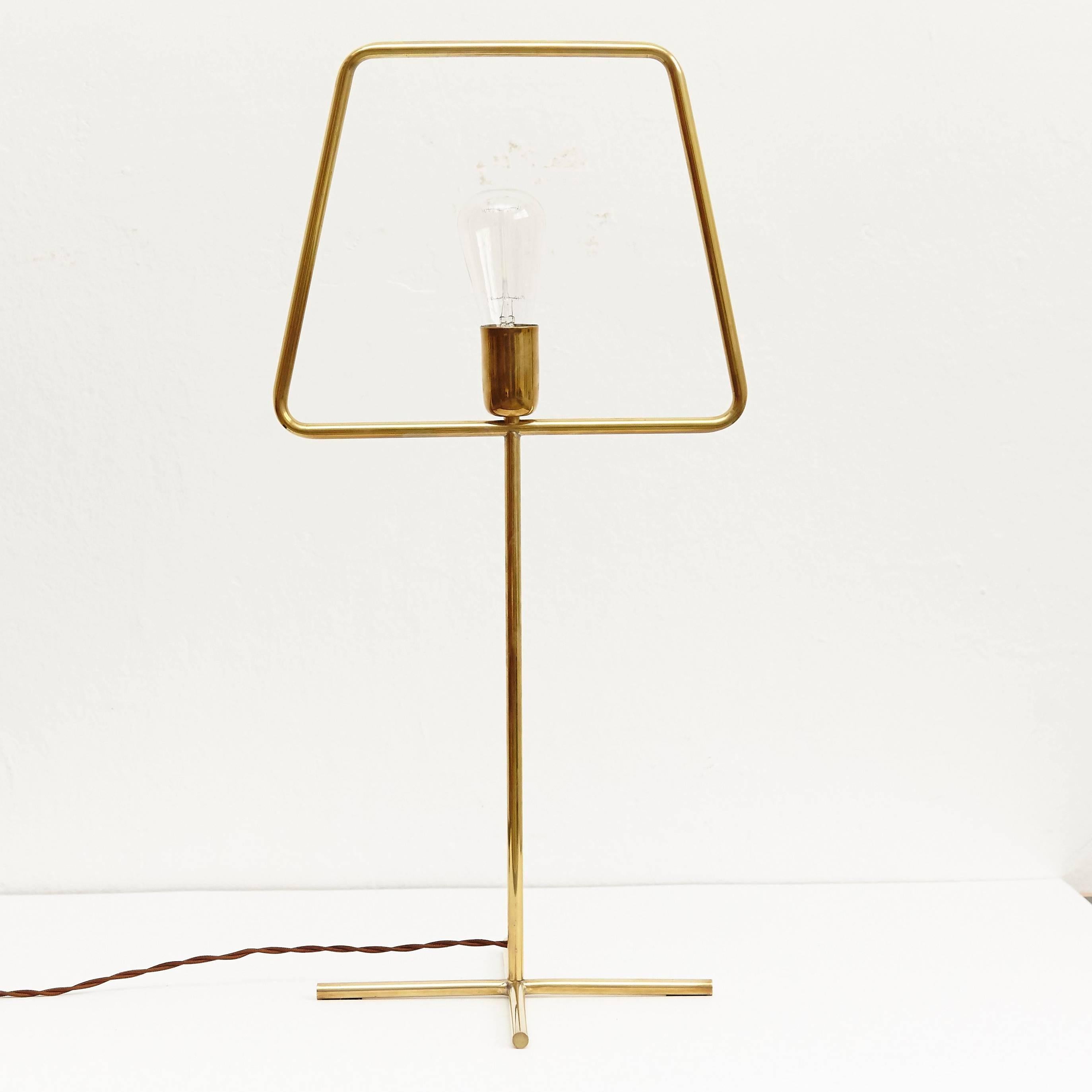 Slim brass is a handmade brass table lamp. It's a special edition of the slim collection with a unique added look.

This lamp is a prototype therefore it's a unique piece.

Designed by Adolfo Abejon (Barcelona).

Adolfo Abejon is the meeting