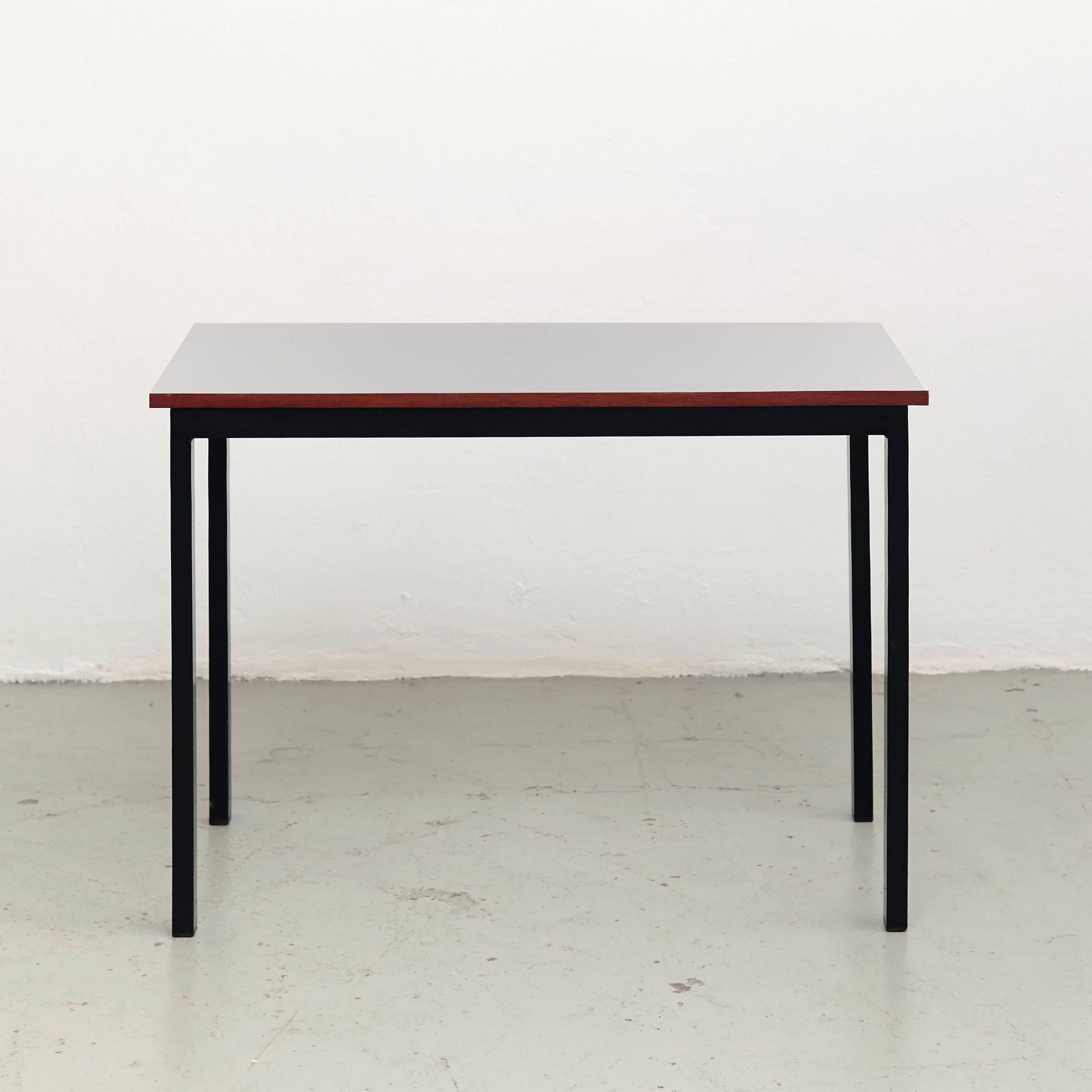 Console designed by Charlotte Perriand, circa 1958.
Manufactured in France, circa 1958.
Laminated plastic-covered plywood, painted steel. 
Grey.

In good original condition, with minor wear consistent with age and use, preserving a beautiful