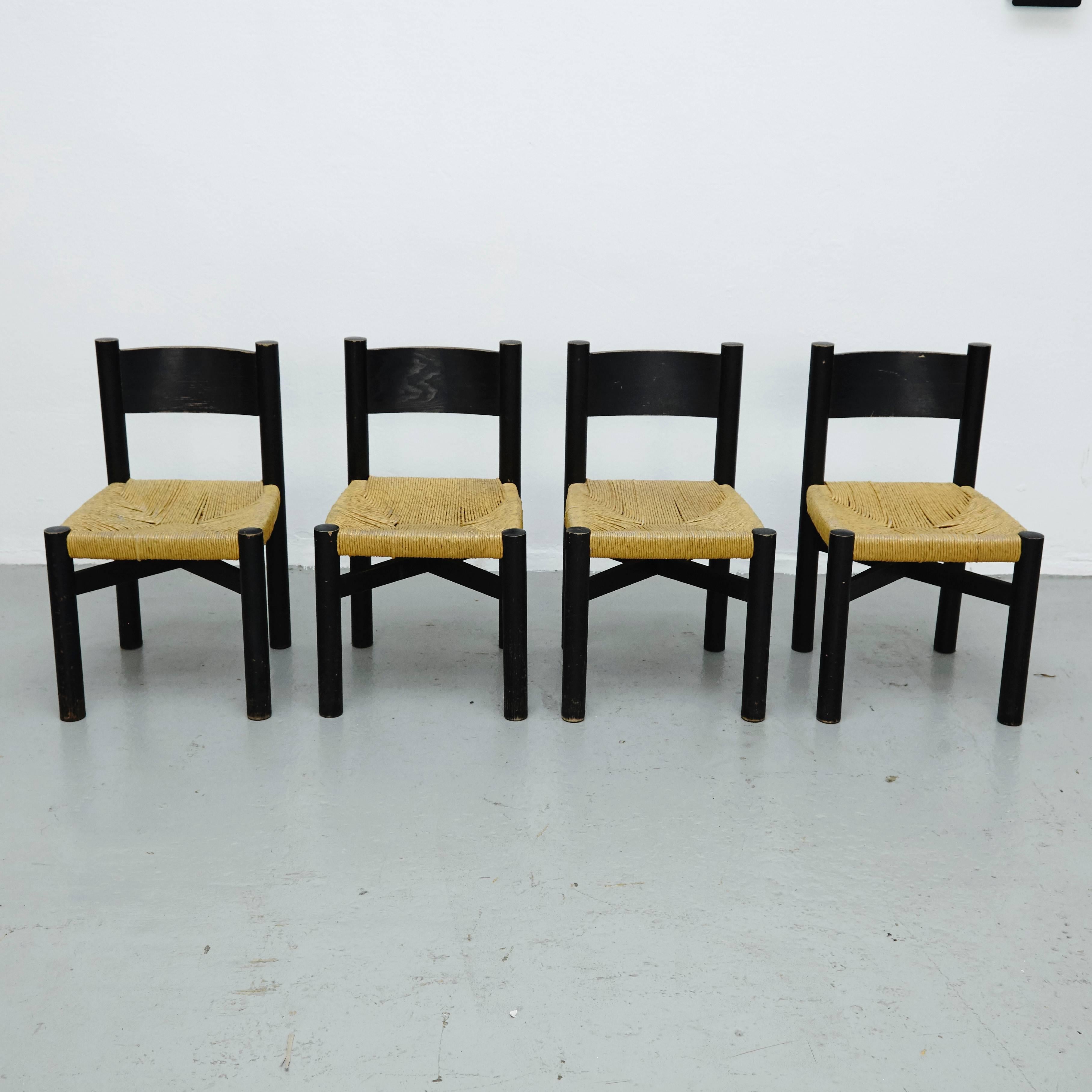 Four chairs, model meribel, designed by Charlotte Perriand, circa 1950.
Manufactured in France.
Wood and rattan. Black lacquer

In good original condition with minor wear consistent with age and use, preserving a beautiful patina.

Charlotte