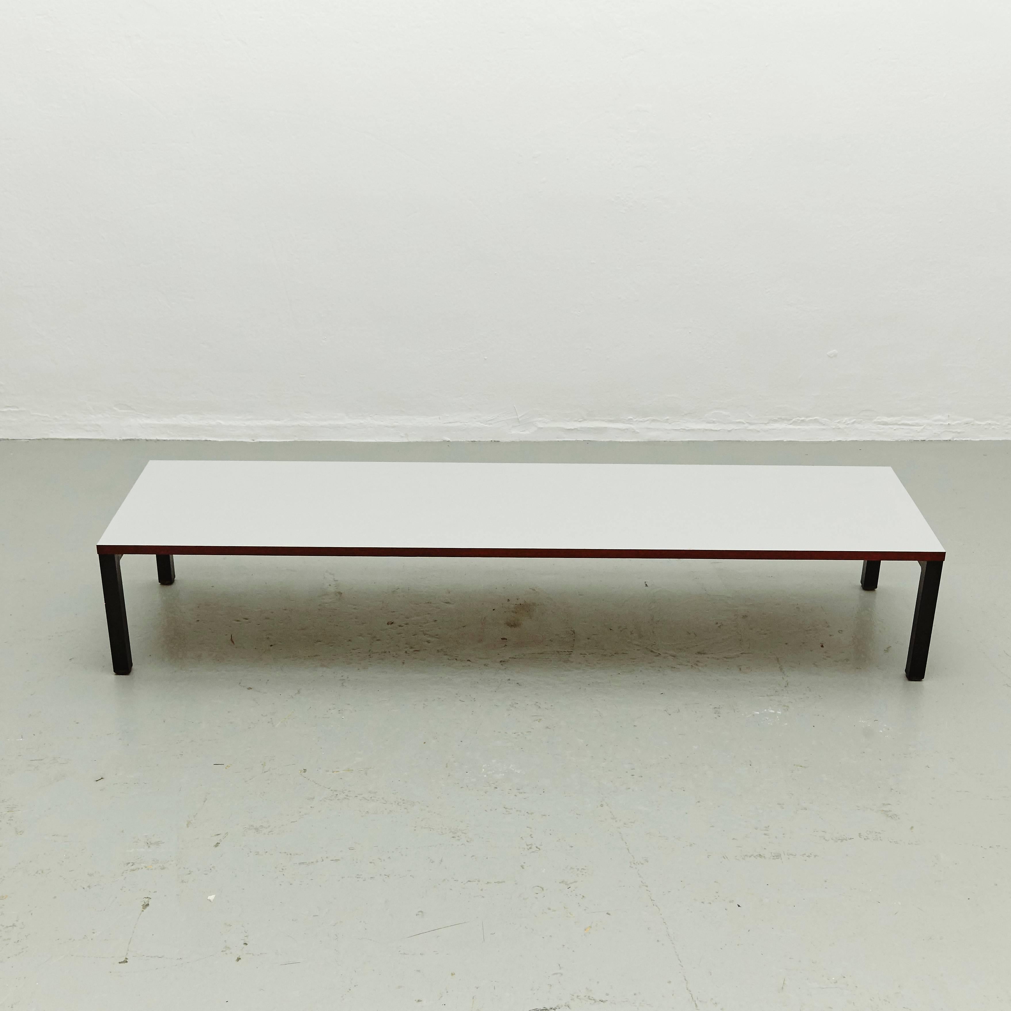 Low console designed by Charlotte Perriand, circa 1958.
Manufactured in France, circa 1958.
Laminated plastic-covered plywood, painted steel. 
Grey.

In good original condition, with minor wear consistent with age and use, preserving a