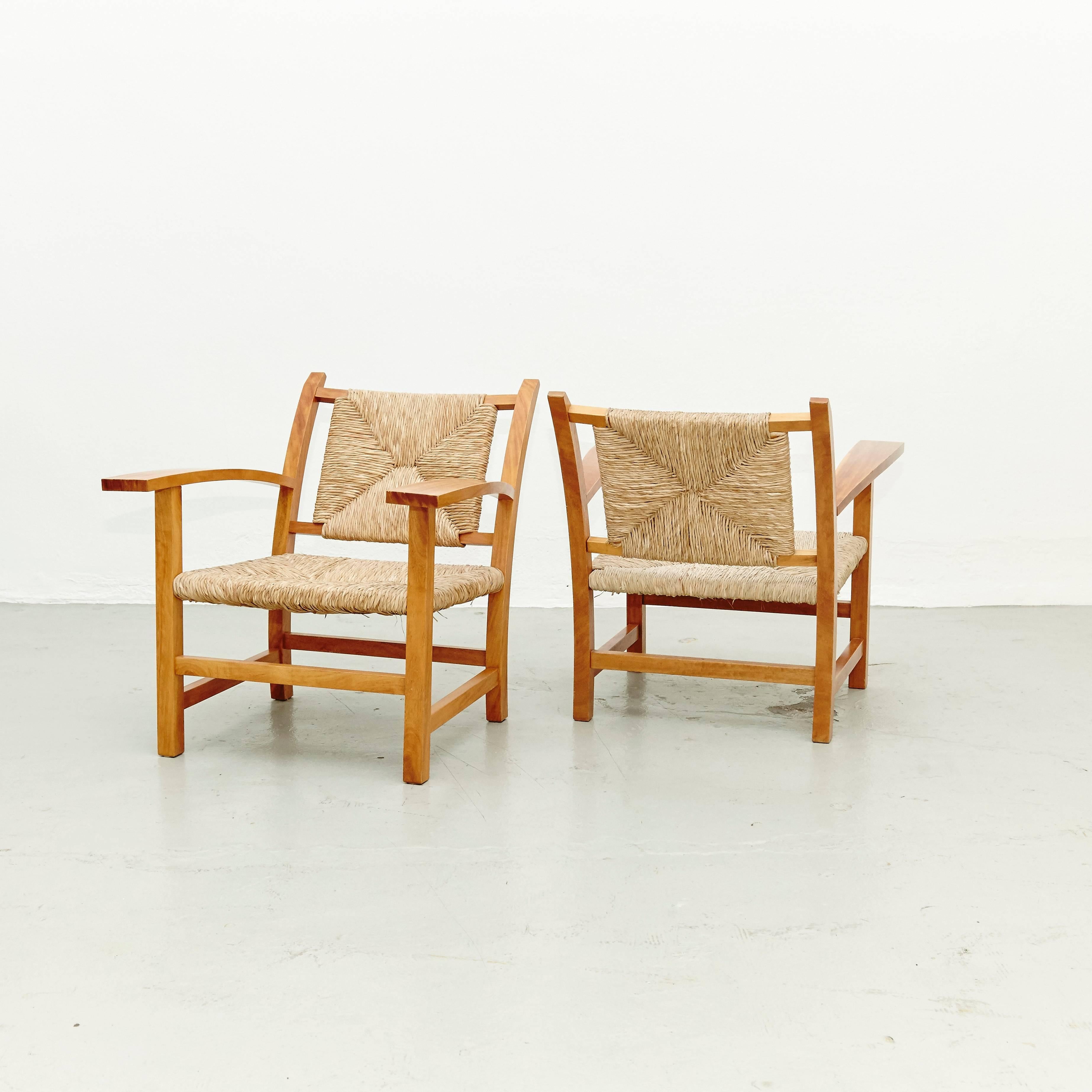 Armchair designed by Josep Torres Clave in 1934.
Manufactured in Spain, circa 1950.
Oak structure and rattan.

In great original condition, with minor wear consistent with age and use, preserving a beautiful patina.

The architect Josep Torres
