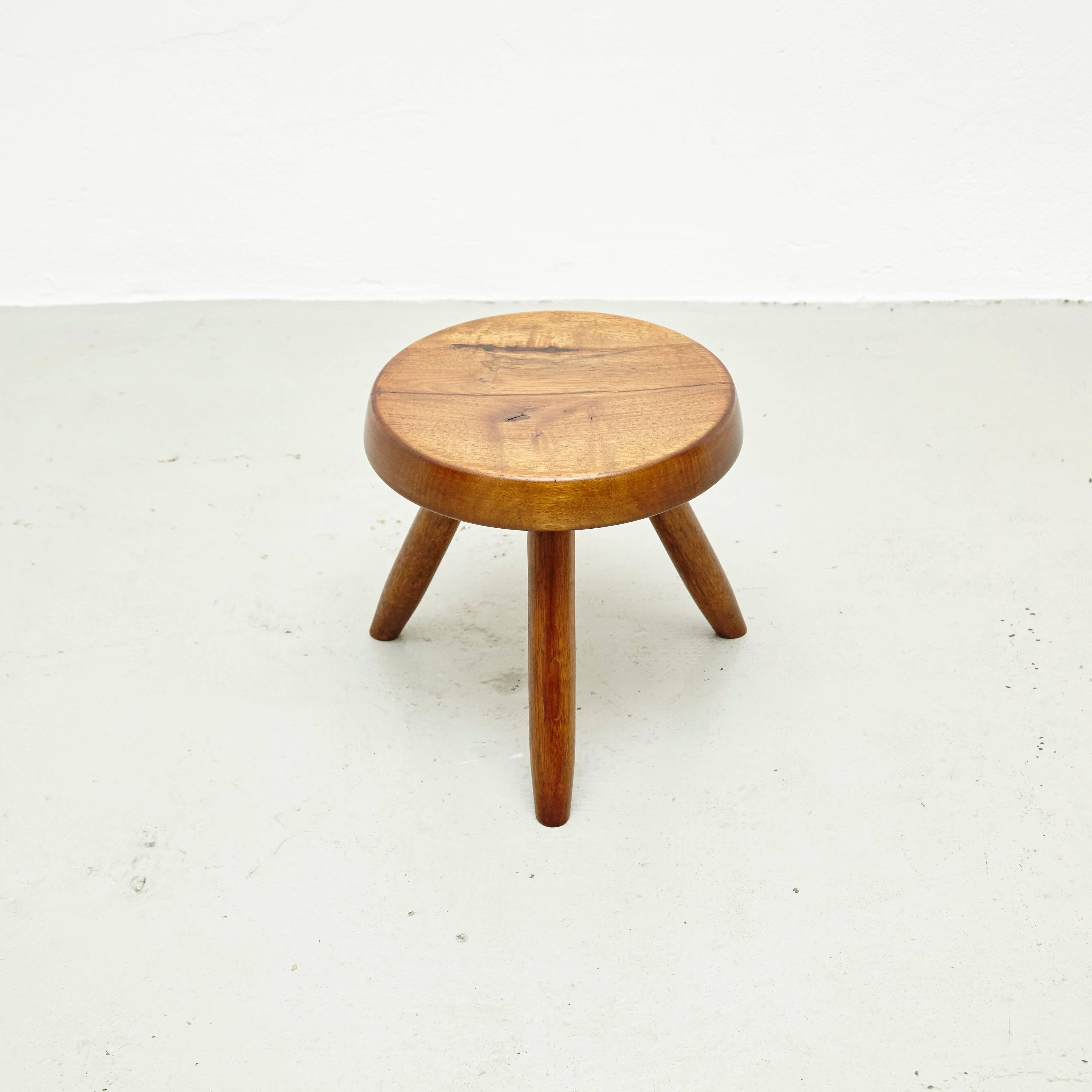 Stool designed in the style of Charlotte Perriand, made by unknown manufacturer.
In good original condition, preserving a beautiful patina, with minor wear consistent with age and use. 

Charlotte Perriand (1903-1999) She was born in Paris in
