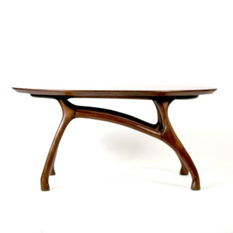 Side table made of mahogany wood. 

Beautiful organic form. 
circa 1970.
