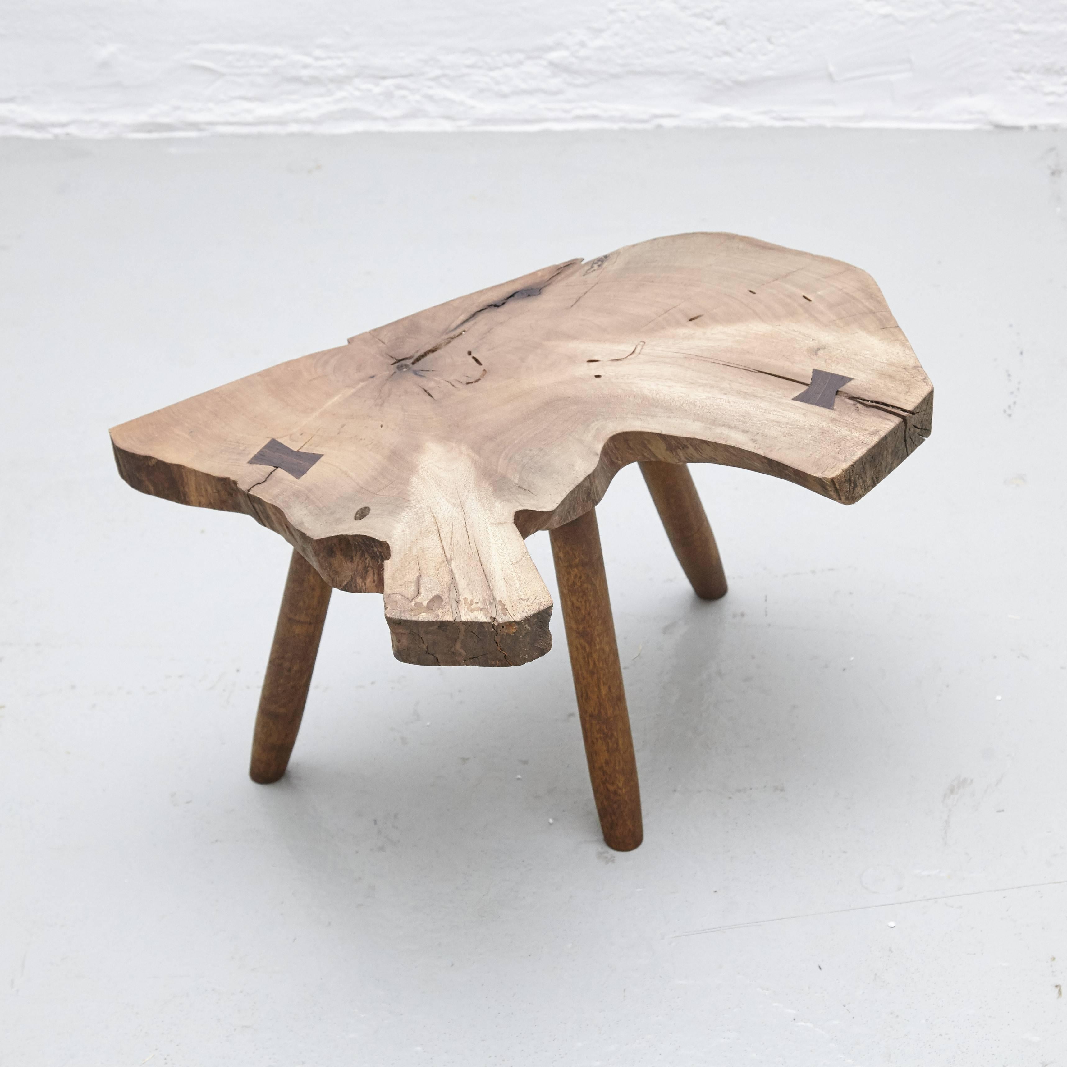 Stool designed in the style of Nakashima, made by unknown manufacturer. 

Wood. 

In good original condition, with minor wear consistent with age and use, preserving a beautiful patina. 

George Katsutoshi Nakashima (May 24, 1905 – June 15,