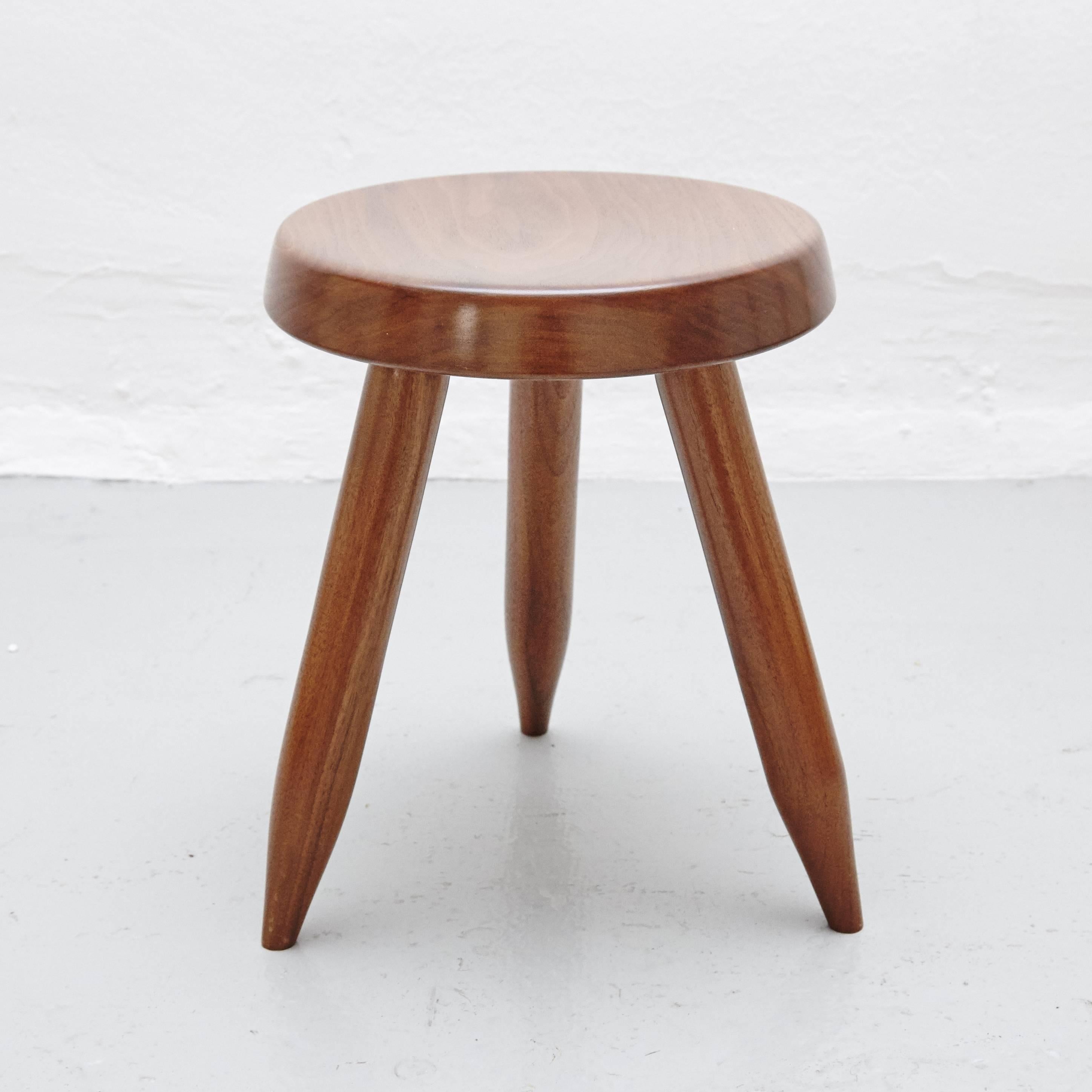 Stool designed in the style of Charlotte Perriand, made by unknown manufacturer.

In good original condition, preserving a beautiful patina, with minor wear consistent with age and use.

Charlotte Perriand (1903-1999). She was born in Paris in