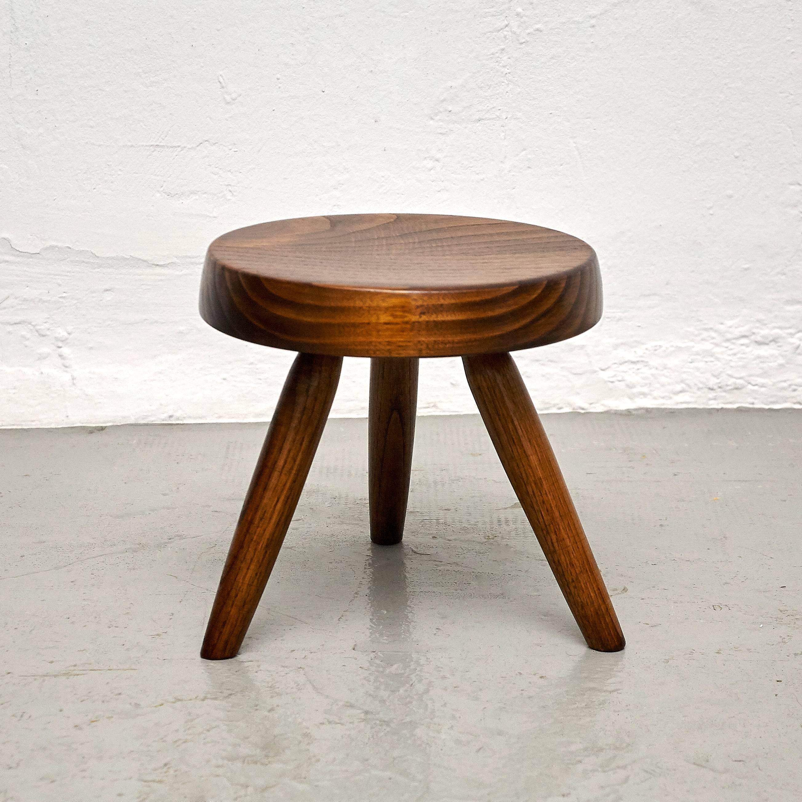 Stool designed in the style of Charlotte Perriand, made by unknown manufacturer.

In good original condition, preserving a beautiful patina, with minor wear consistent with age and use. 

Charlotte Perriand (1903-1999) She was born in Paris in