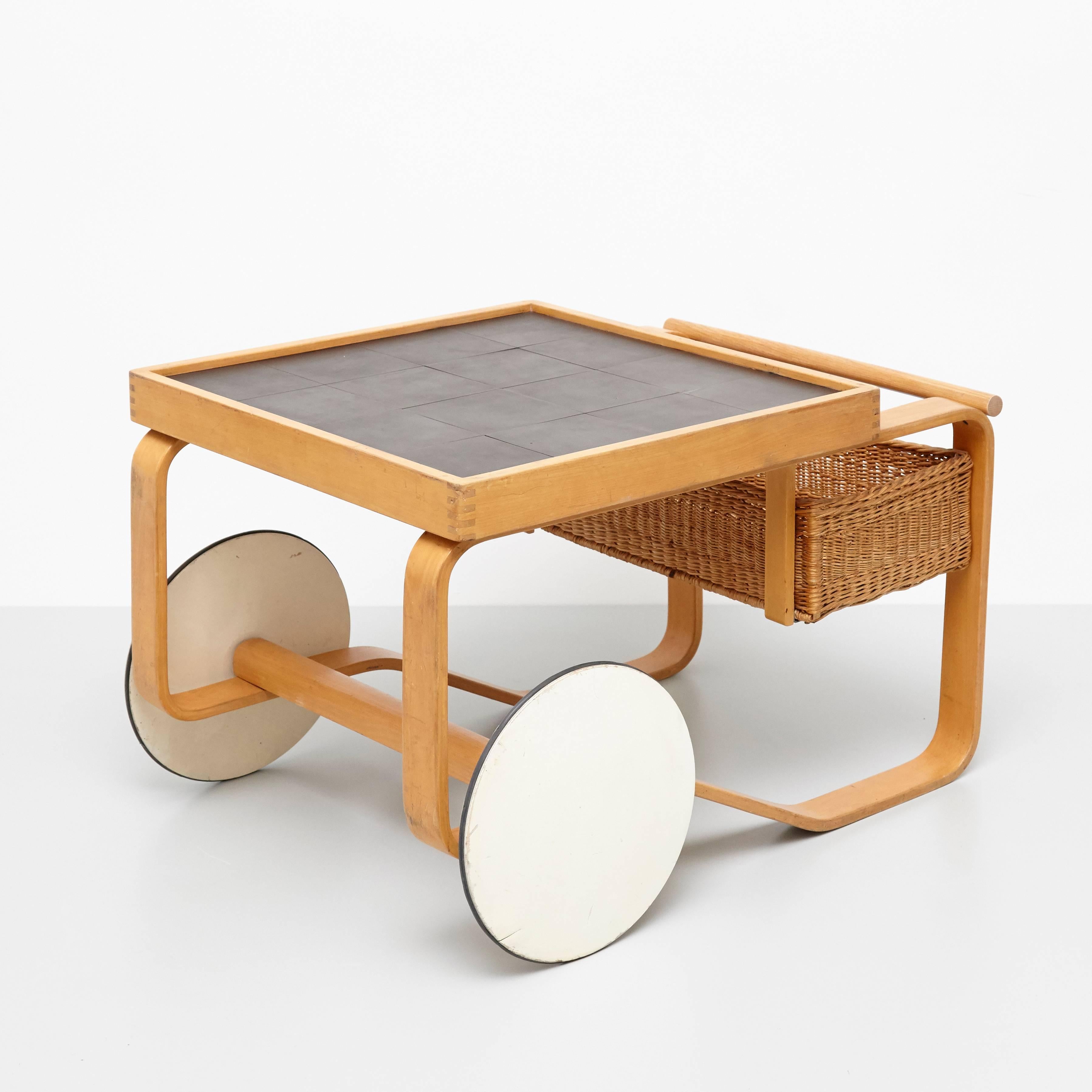 Tea trolley model 900, designed by Alvar Aalto for Artek, Finland, 1935. 

Birch, ceramic tiles and cane.

64 x 91 x 59 cm

In great original condition, with minor wear consistent with age and use, preserving a beautiful patina. 

Hugo Alvar