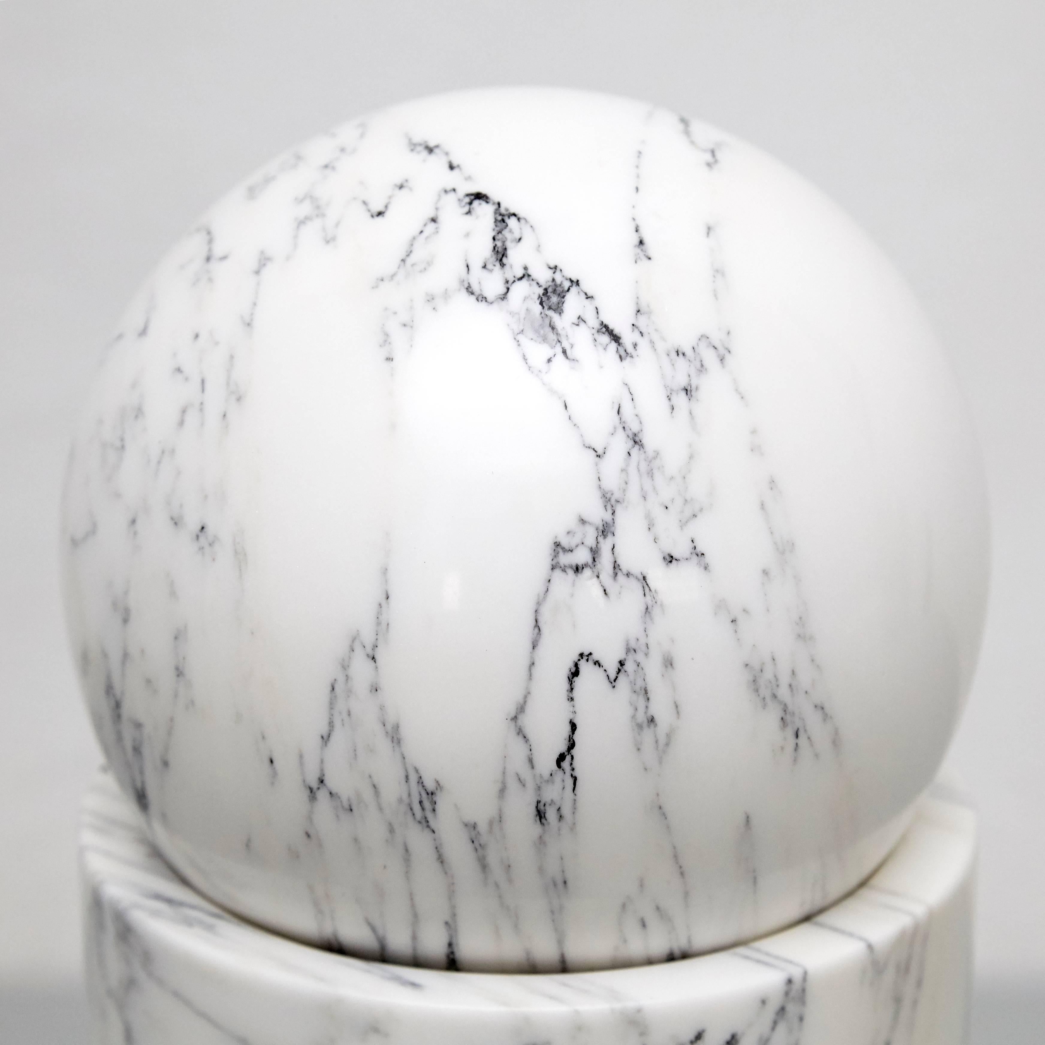 Marble sculpture designed by Man Ray in 1920 and made in 1972 by the artist.

Signed and numbered 114/500.

Man Ray (1890–1976) was an American visual artist who spent most of his career in France. He was a significant contributor to the Dada