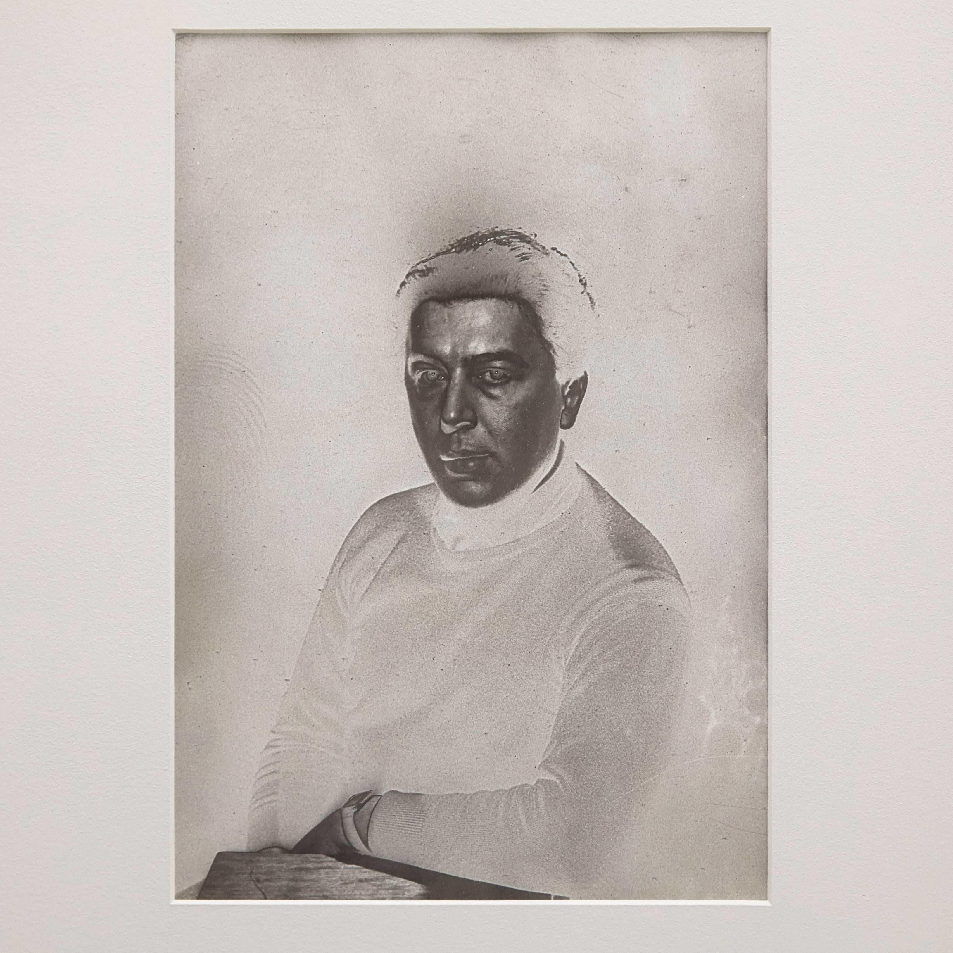 Portrait of Andre Breton photographed by Man Ray

A posthumous print from the original negative around 1970 by Pierre Gassmann. Gelatin silver bromide.

Framed in a 19th century frame with museum glass.

Stamped in the back with Man Ray Paris