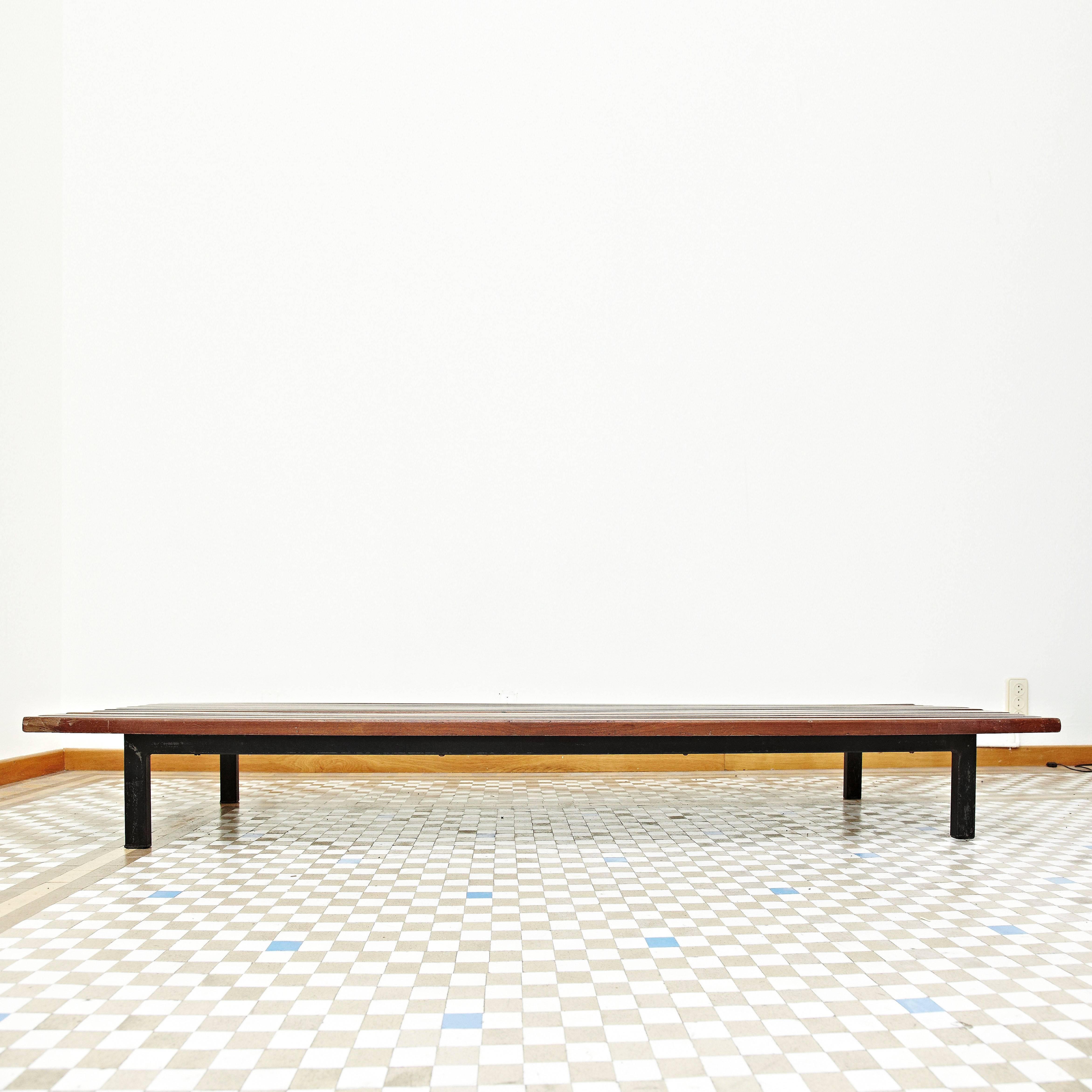 Bench designed by Charlotte Perriand, circa 1950.
Mahogany wood, metal frame legs.

Provenance: Cansado, Mauritania (Africa).

In good original condition, with minor wear consistent with age and use, preserving a beautiful patina. 

Charlotte