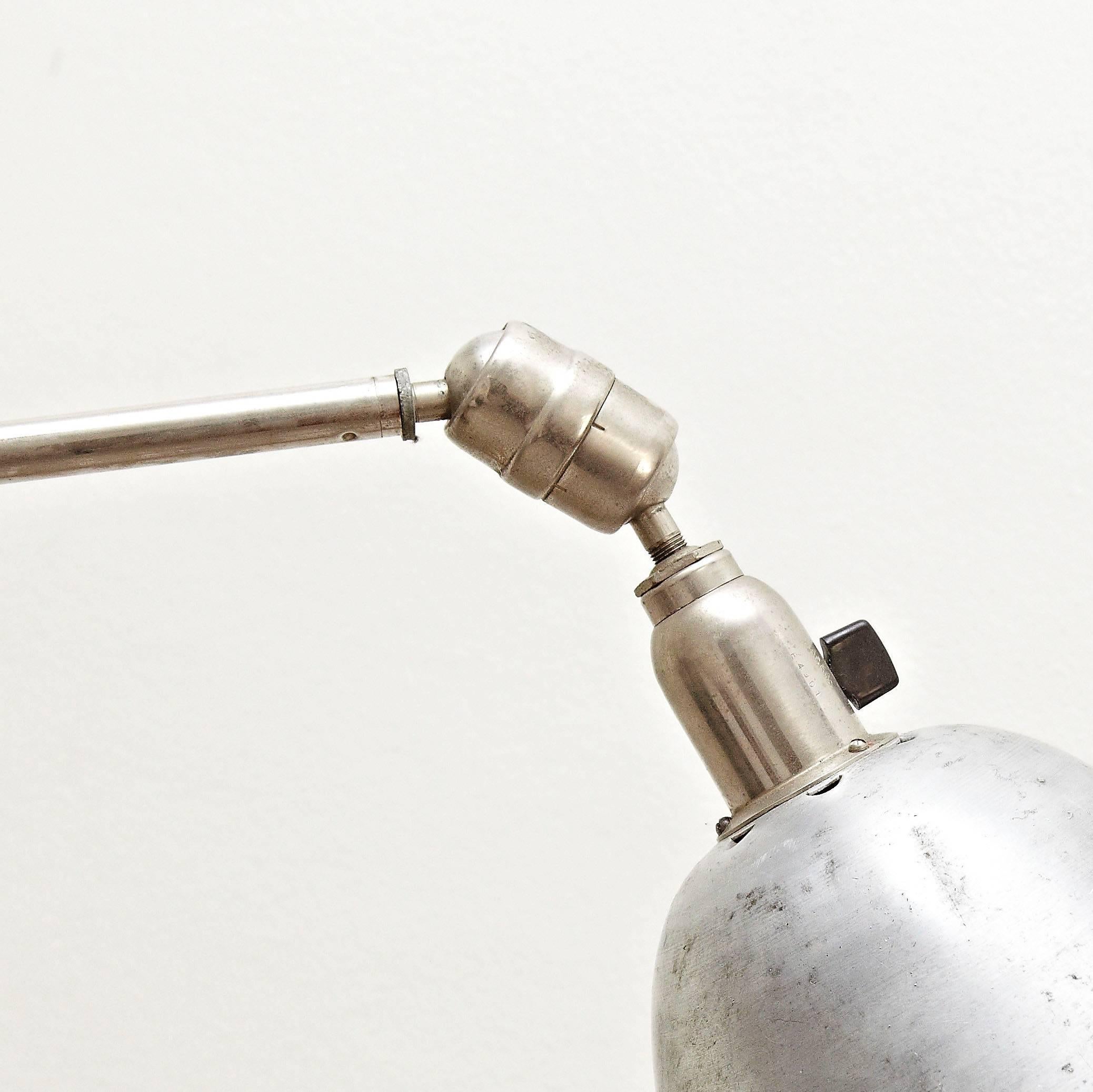 Wall lamp designed by Johan Petter Johansson.
Manufactured by Triplex (Sweden), circa 1930.
Aluminium and steel.

In good original condition, with minor wear consistent with age and use, preserving a beautiful patina.

 