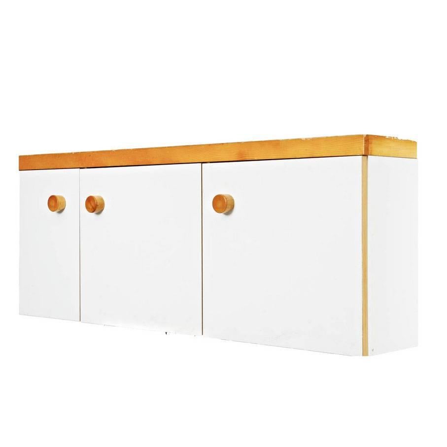 Three doors wall mounted sideboard designed by Charlotte Perriand for Les Arcs ski Resort around 1960, manufactured in France.

Pine wood and lacquered top.

In good original condition, with minor wear consistent with age and use, preserving a