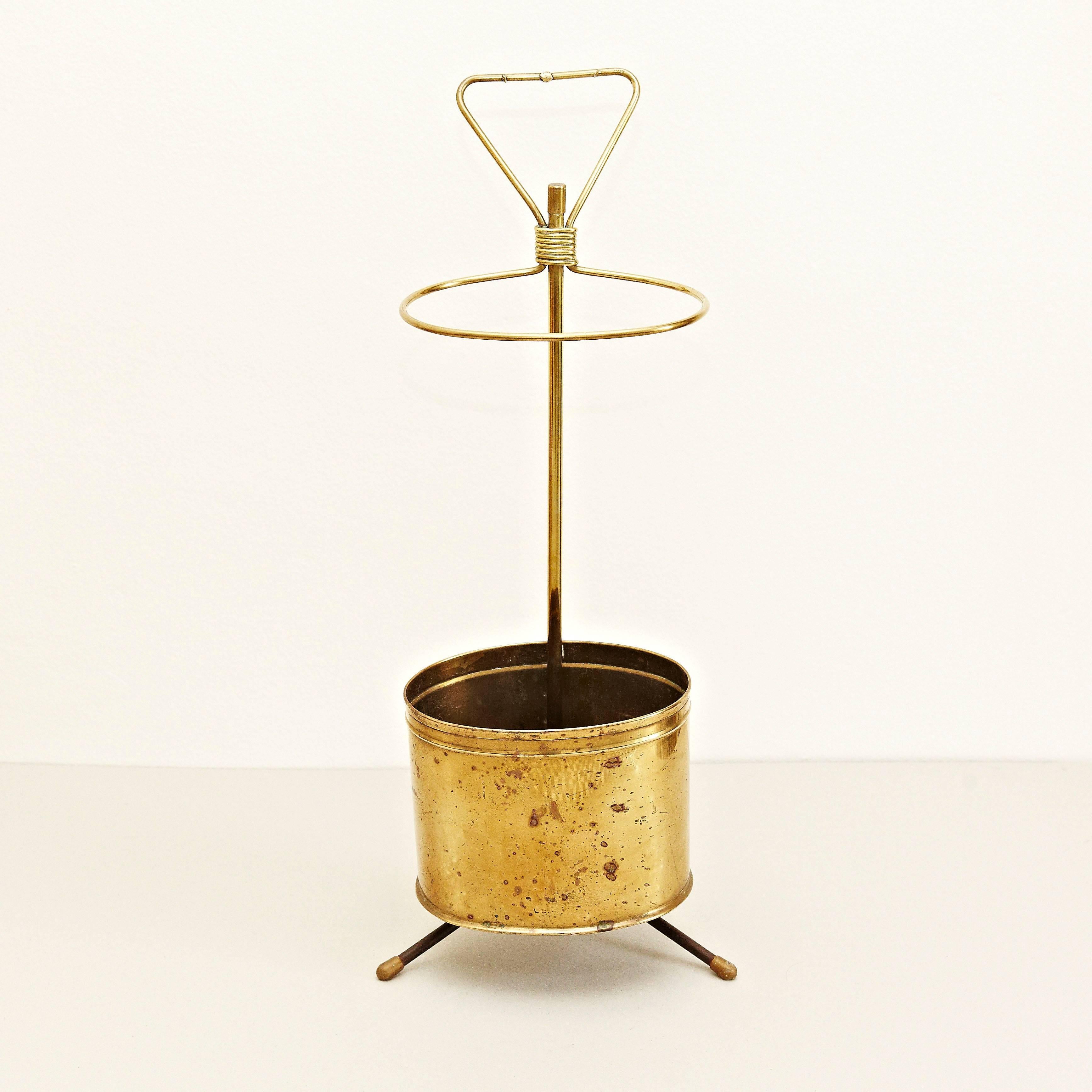 Umbrella stand designed by Mathieu Matégot.
Manufactured by Ateliers Matégot (France), circa 1950.
Umbrella stand in bronze.

In good original condition, with minor wear consistent with age and use, preserving a beautiful patina.

Mathieu