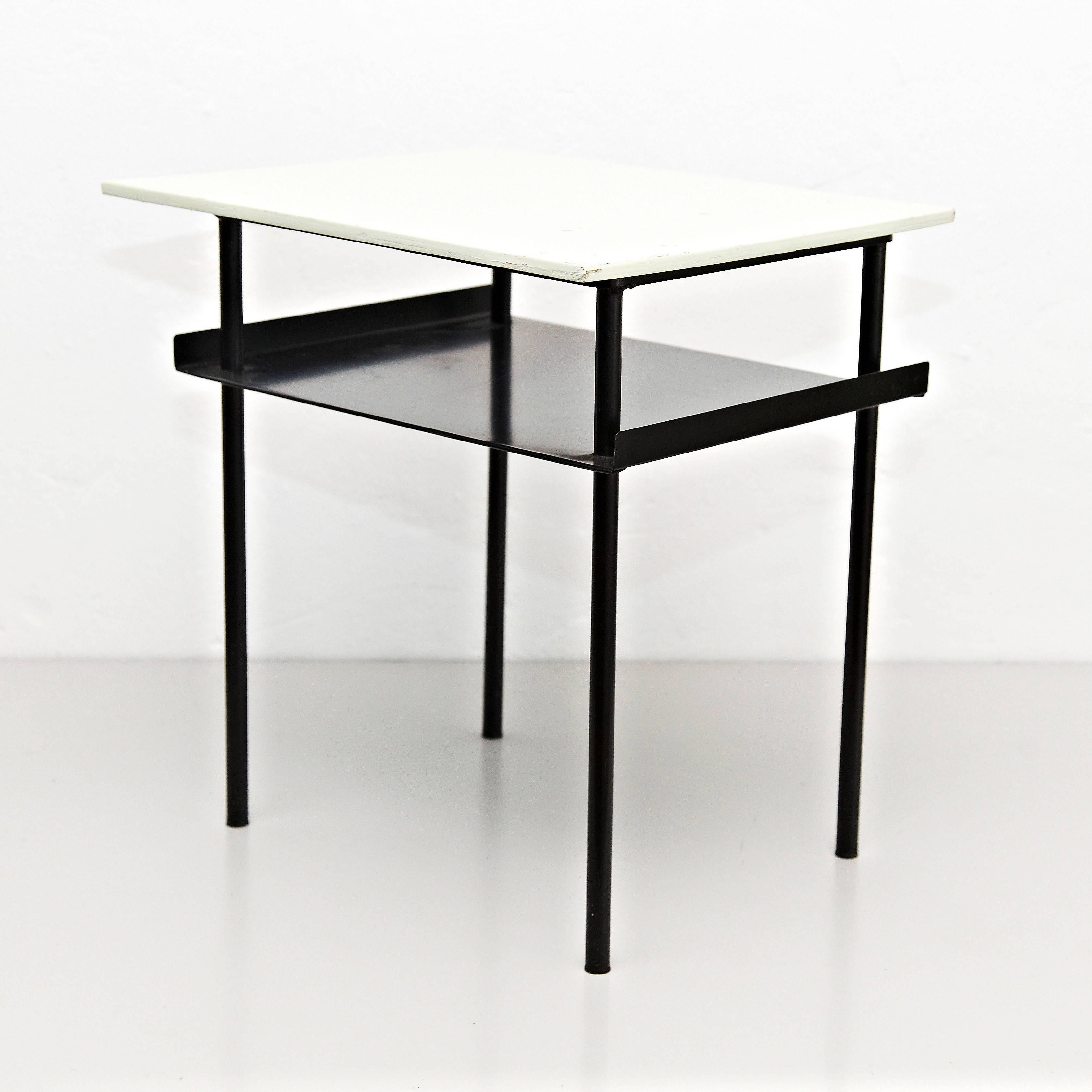 Coffee Table designed by Wim Rietveld around 1950, manufactured in Netherlands.

Lacquered metal frame and wood top.

In good original condition, preserving a beautifull patina.