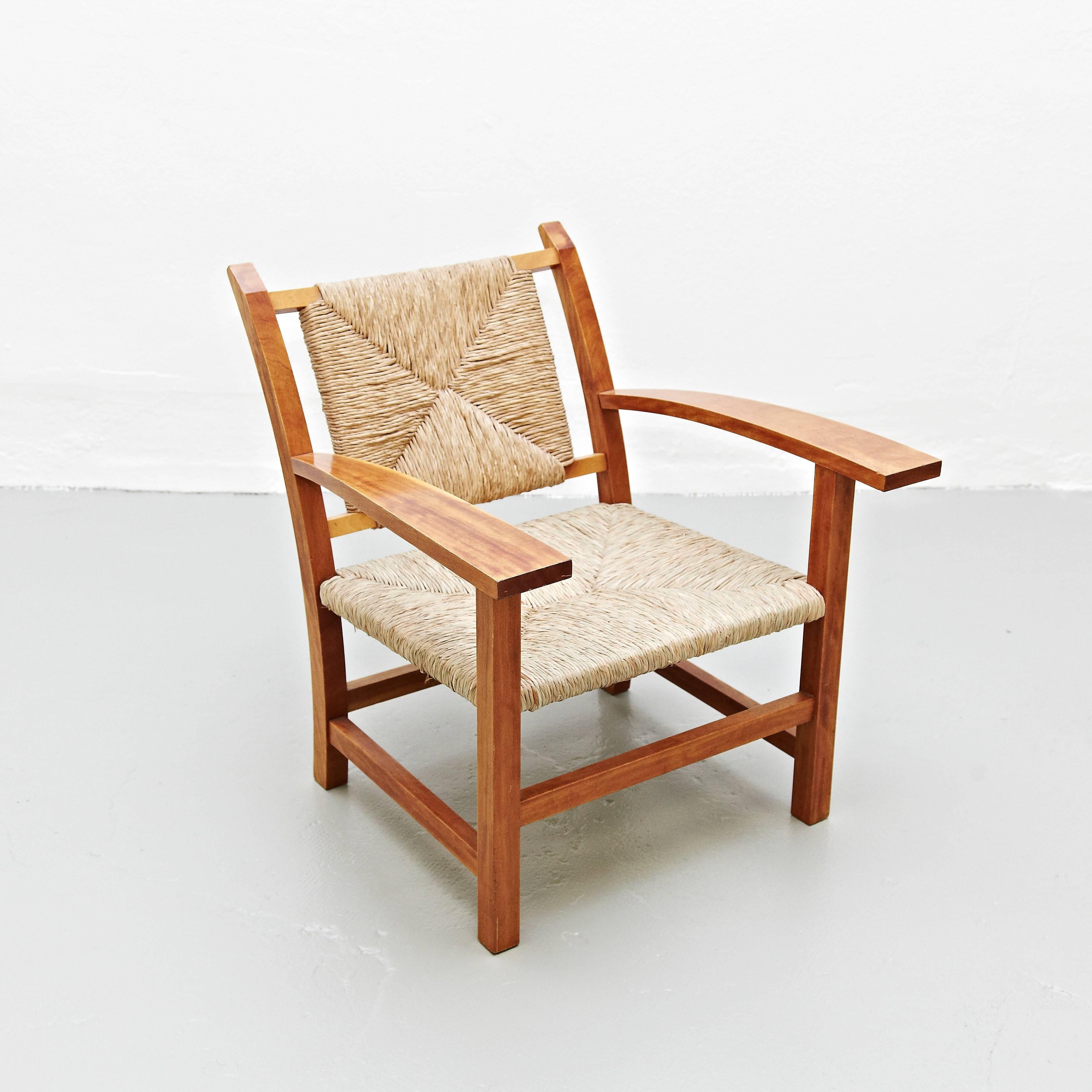 Armchair Designed by Josep Torres Clave in 1934
Manufactured in Spain, circa 1950
Oak structure and rattan.

In great original condition, with minor wear consistent with age and use, preserving a beautiful patina.

The architect Josep Torres