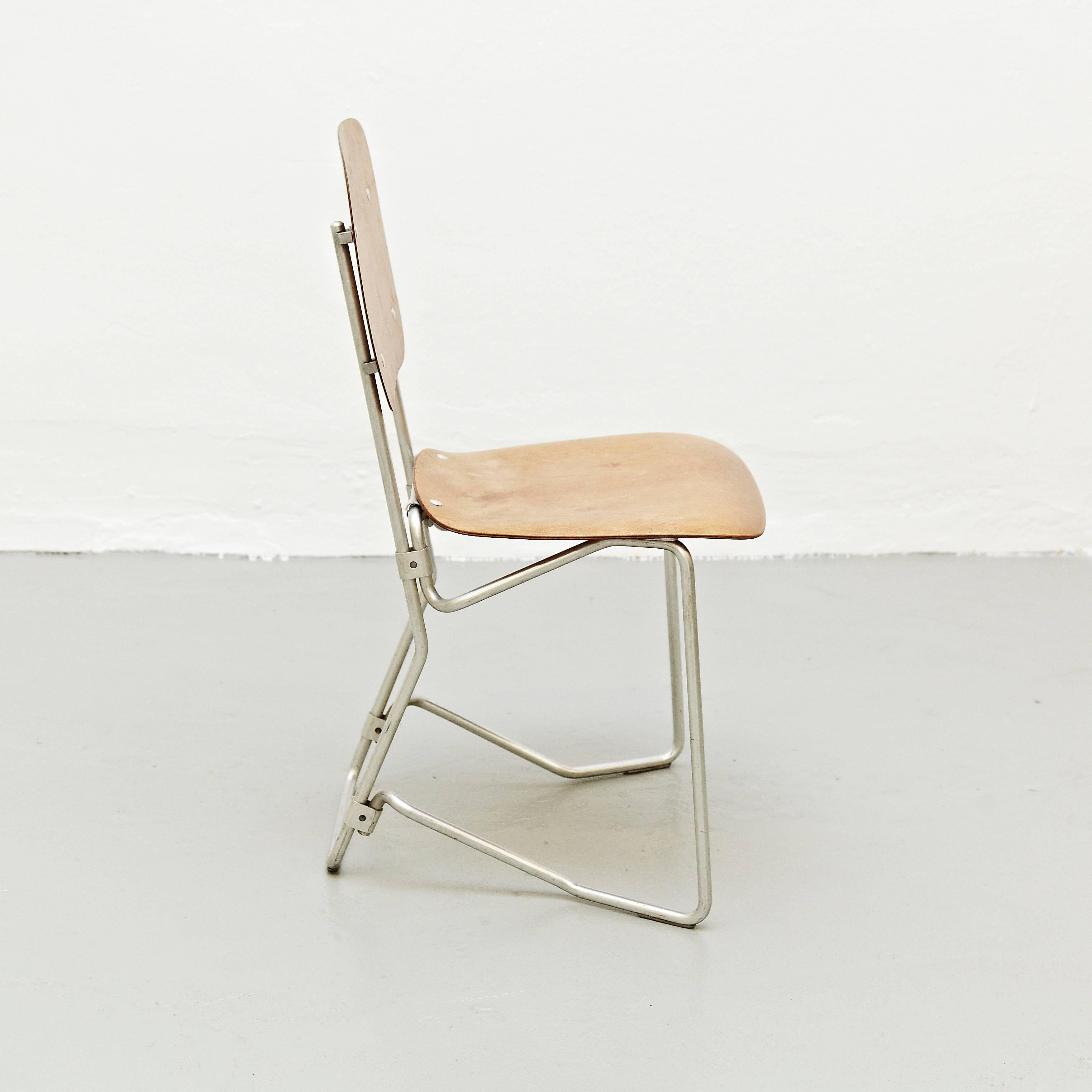Stackable Aluflex chairs by Armin Wirth for Aluflex, Switzerland, 1950s. 

Rare first edition pair of chairs.

In good original condition, with minor wear consistent with age and use, preserving a beautiful patina.