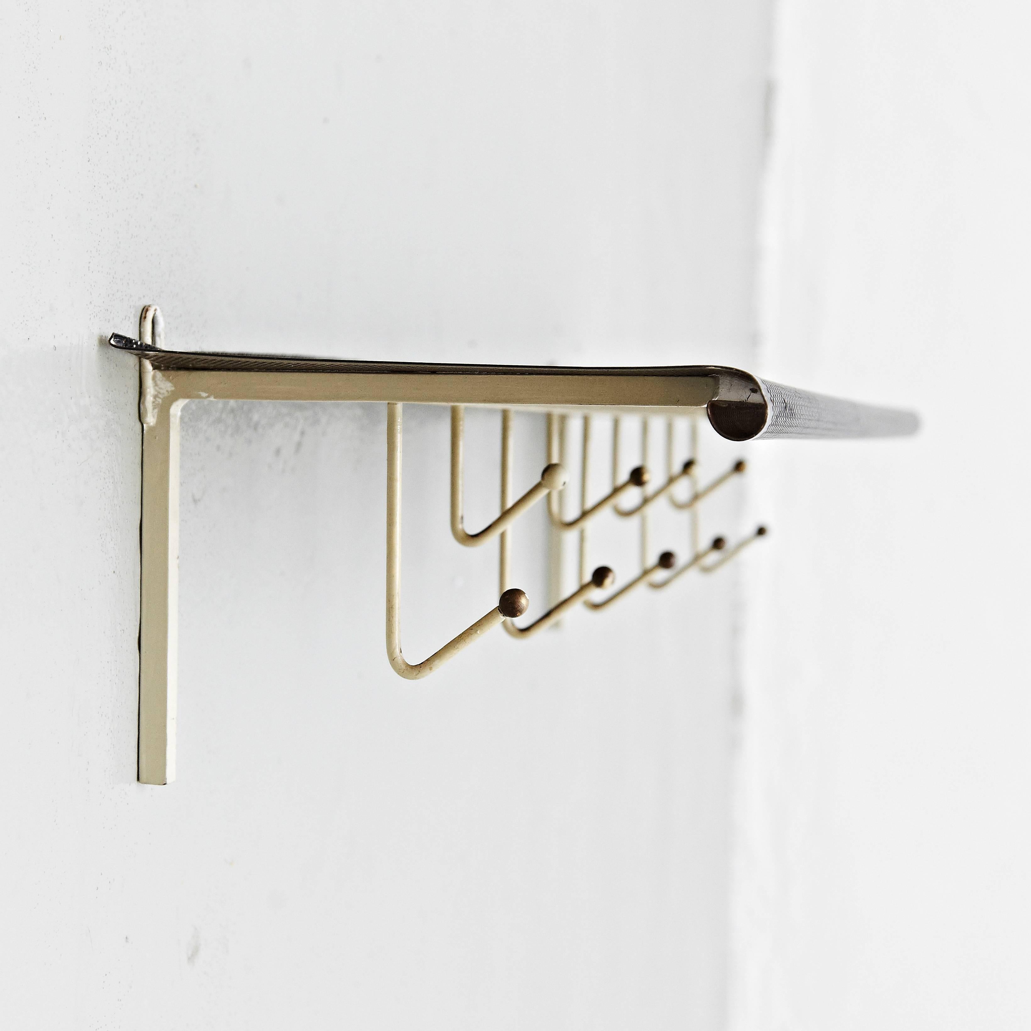 Coat rack designed by Mathieu Matégot.
Manufactured by Artimeta (Netherland), circa 1940.
Perforated, lacquered metal.

In good original condition, with minor wear consistent with age and use, preserving a beautiful patina.

Mathieu Matégot
