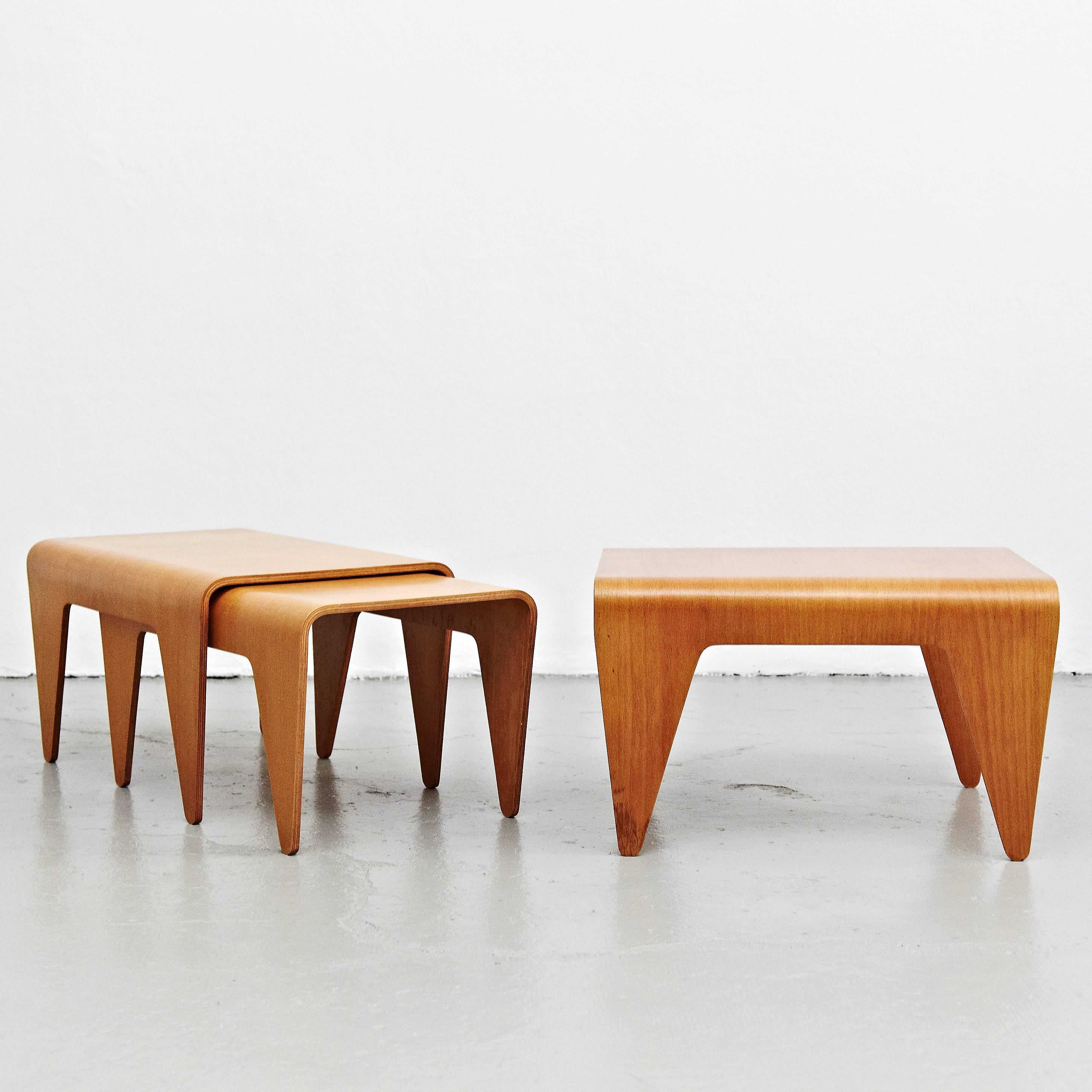 Set of three tables designed by Marcel Breuer, circa 1936 in Hungary.
Manufactured by Isokon (United Kingdom).
Beech plywood.

This set of three nesting tables are designed by the Hungarian Bauhaus designer Marcel Breuer. They each are a one beech