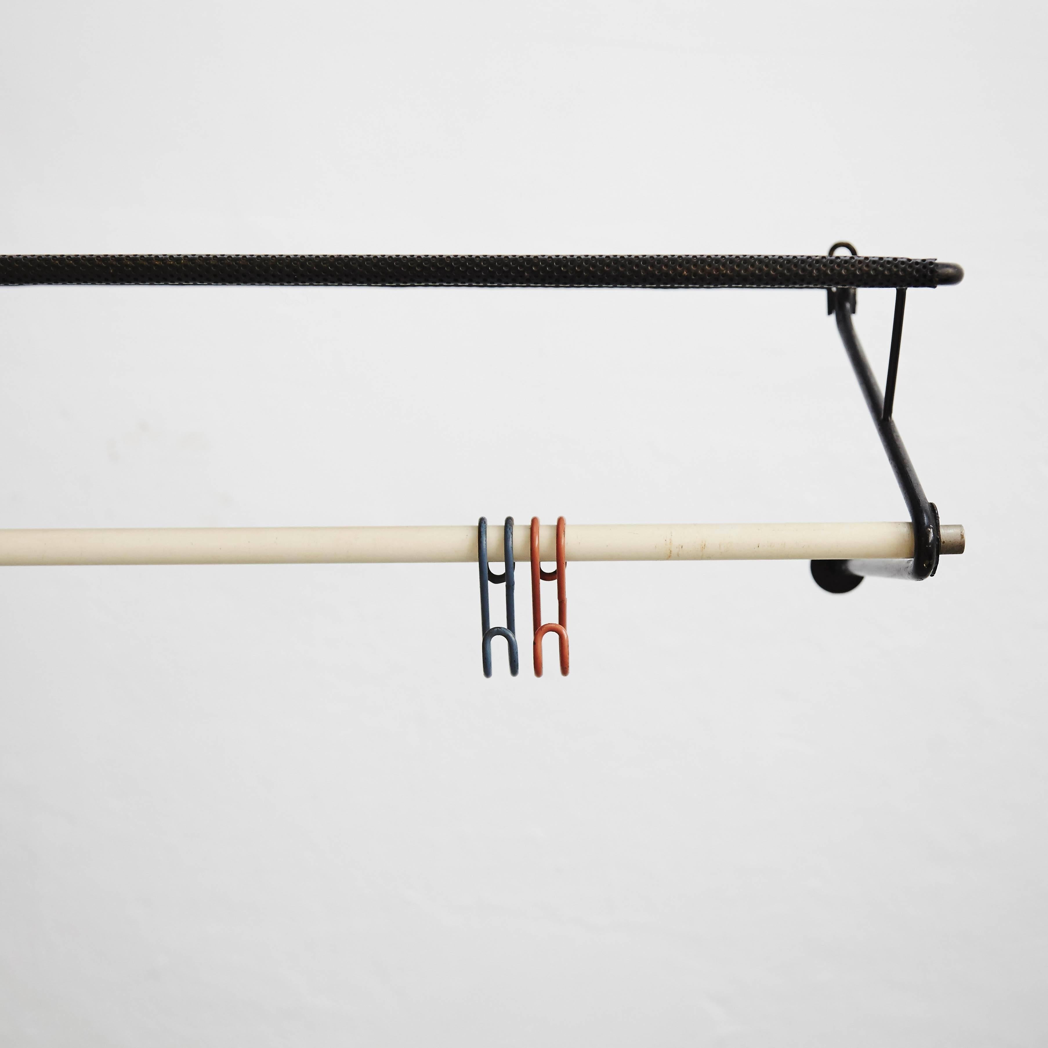 Coat rack designed by Mathieu Matégot.
Manufactured by Artimeta (Netherland), circa 1950.
Perforated and lacquered metal.

In good original condition, with minor wear consistent with age and use, preserving a beautiful patina.

Mathieu
