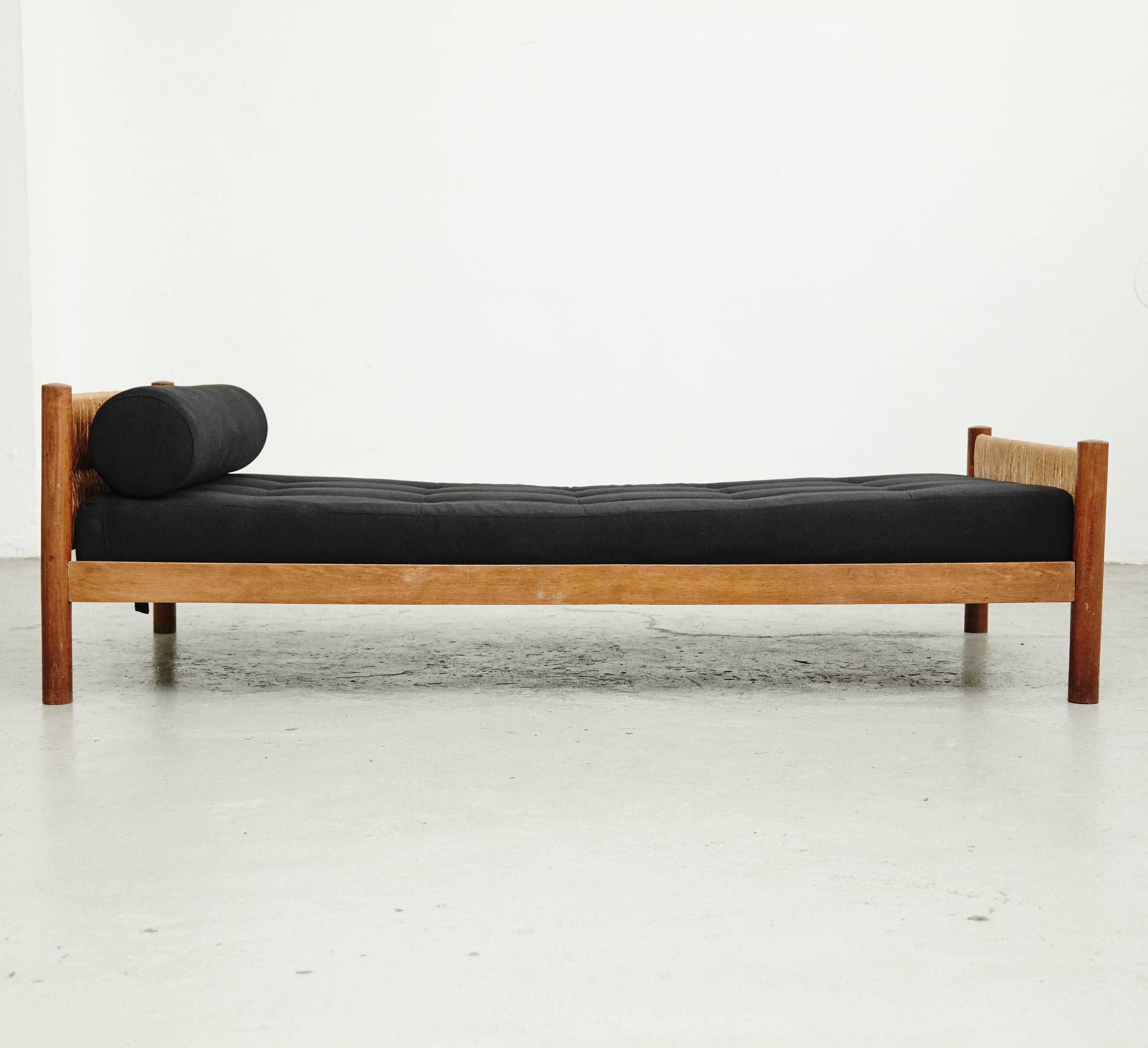 Bed model meribel, designed by Charlotte Perriand, circa 1950, manufactured in France.

Wood, rattan and new upholstery.

In good original condition, with minor wear consistent with age and use, preserving a beautiful patina.

Charlotte